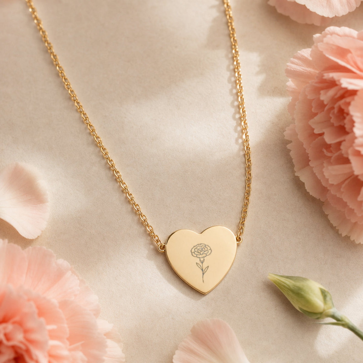 January birth flower necklace — carnation heart pendant hero with carnation blooms
