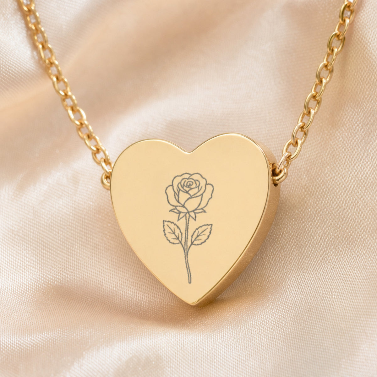 June rose engraving close-up — laser-etched detail on heart pendant in 18K Gold PVD