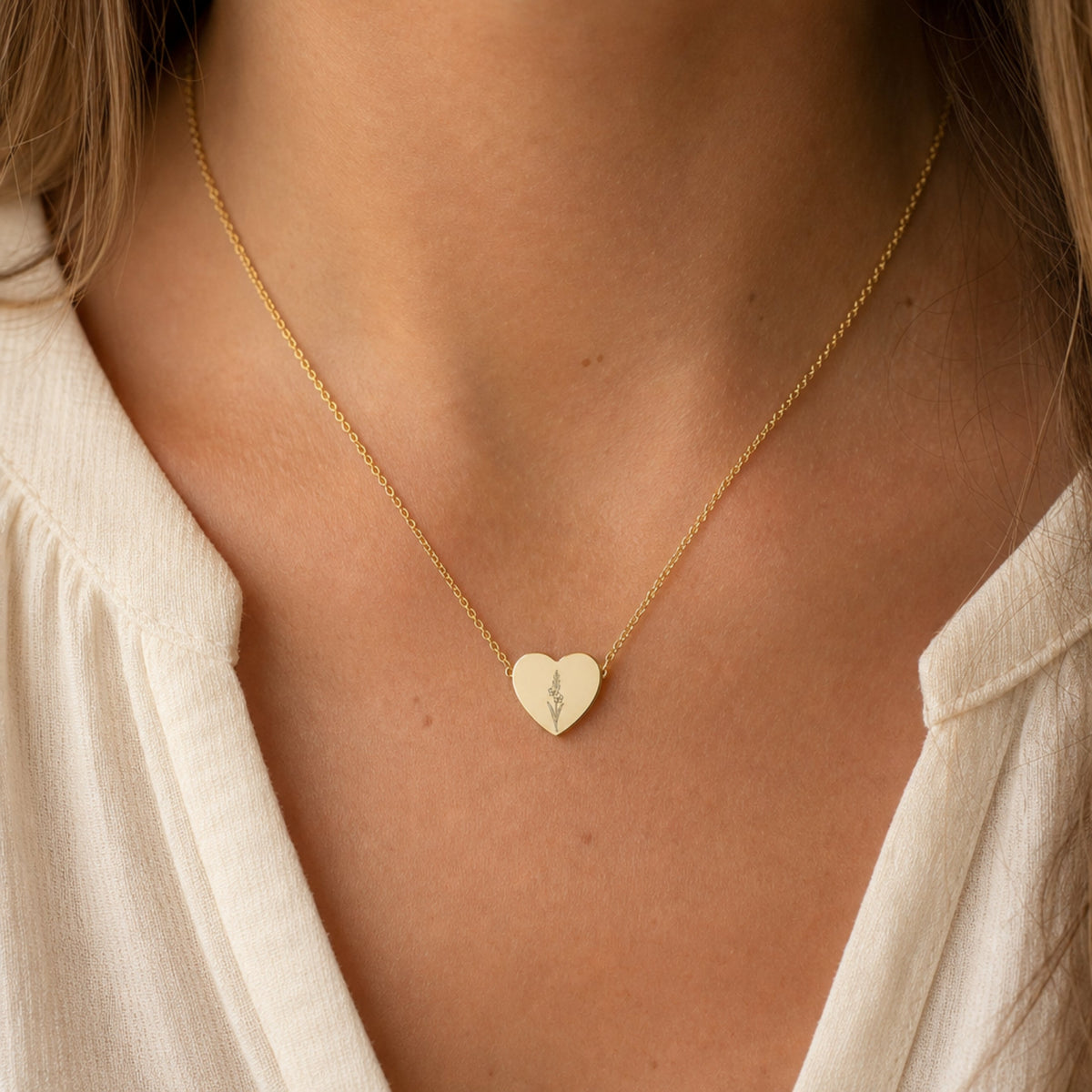 August birth flower necklace with gladiolus engraving in 18K Gold PVD, worn on model