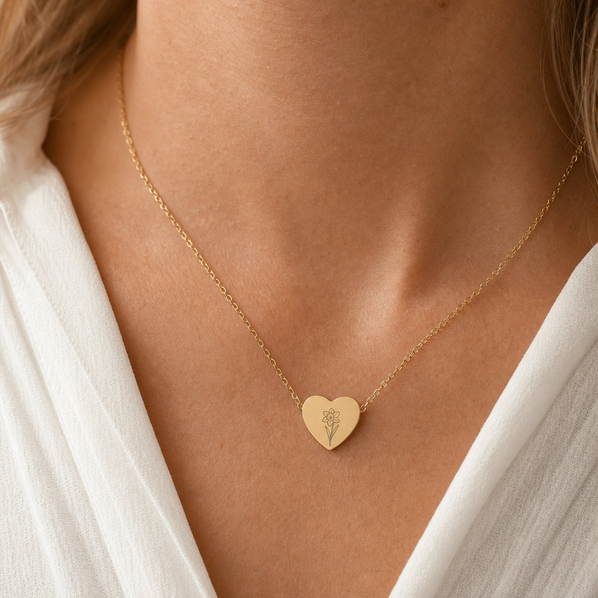 March birth flower necklace with daffodil engraving in 18K Gold PVD, worn on model