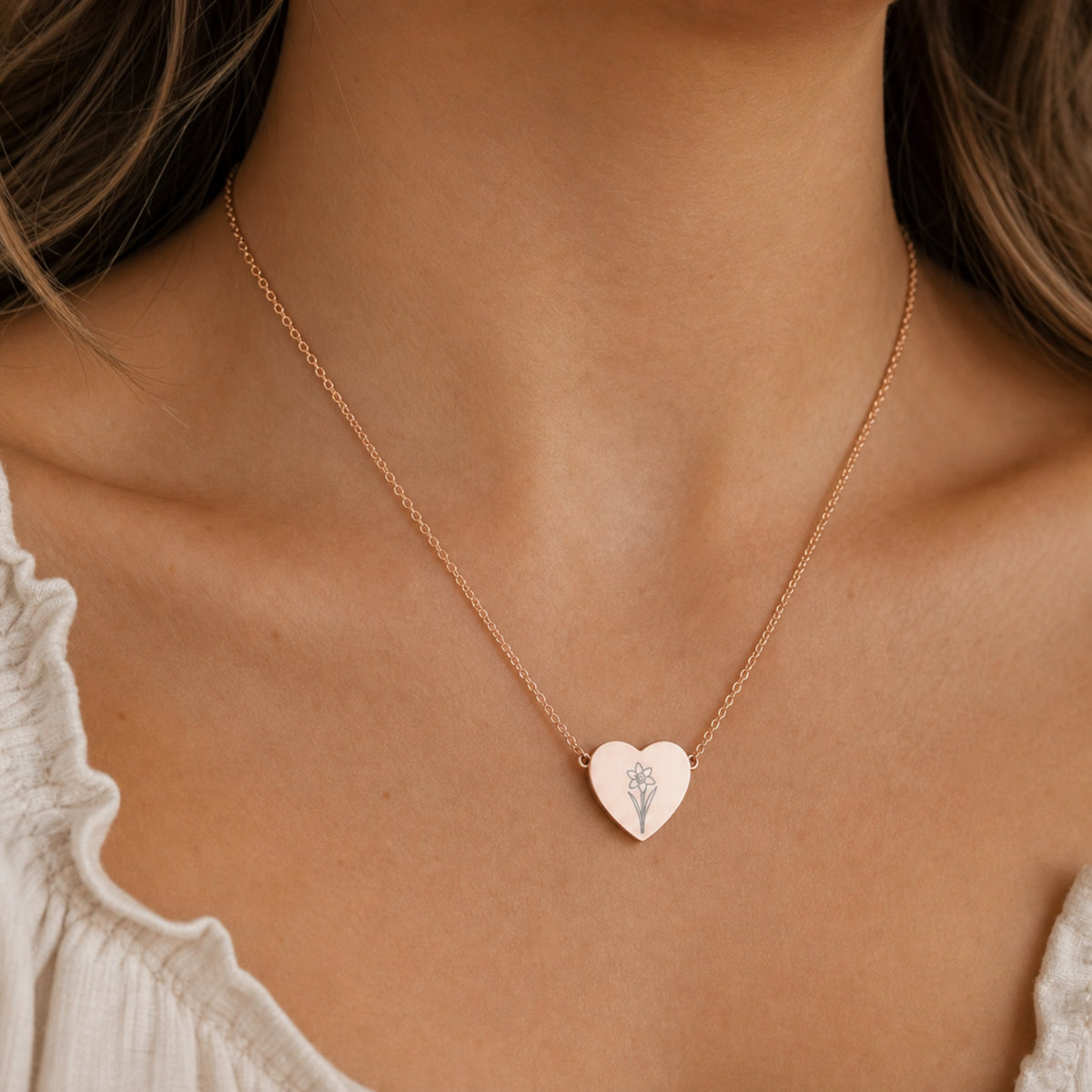 December birth flower necklace with narcissus engraving in 18K Rose Gold PVD, worn on model