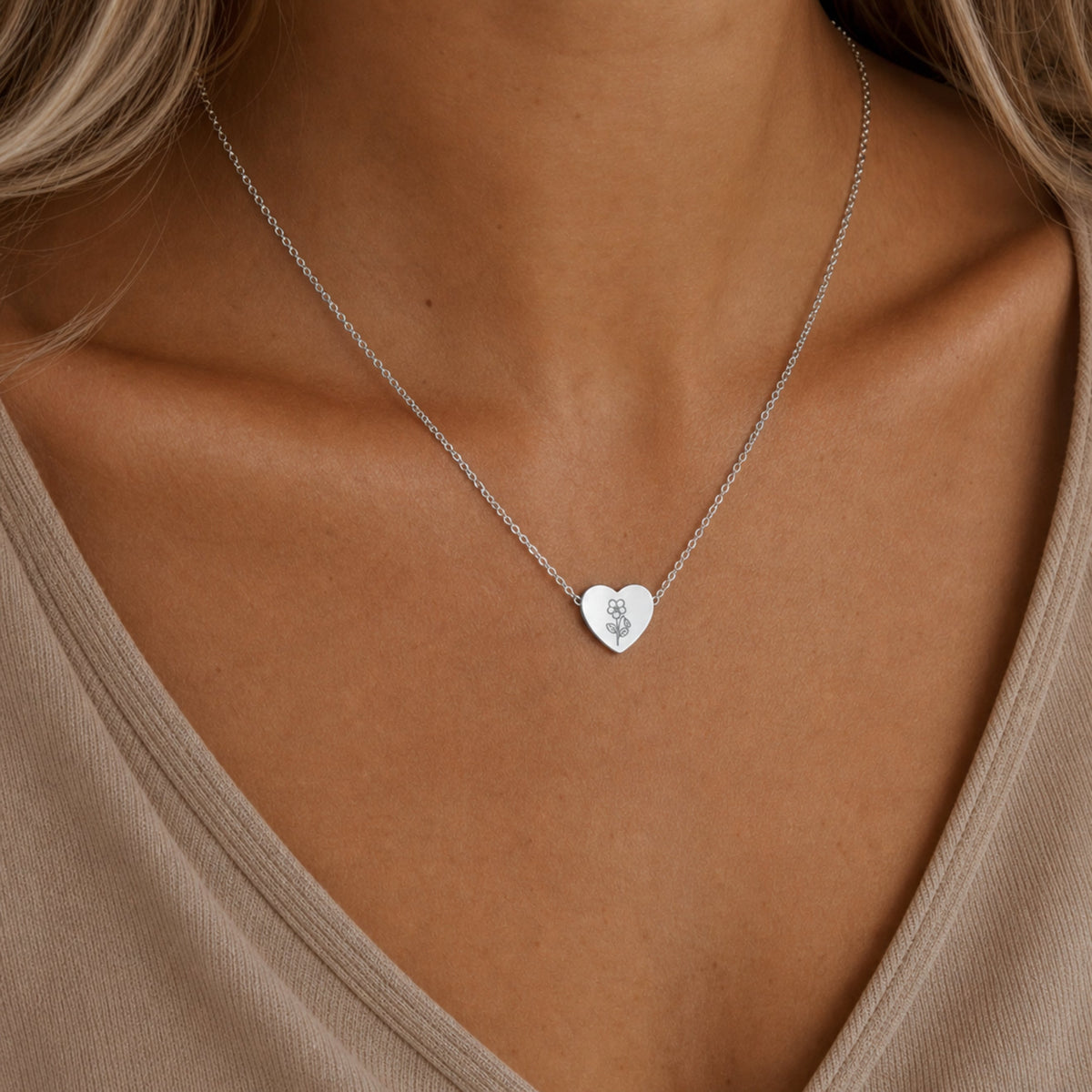 February birth flower necklace with violet engraving in polished 316L stainless steel, worn on model