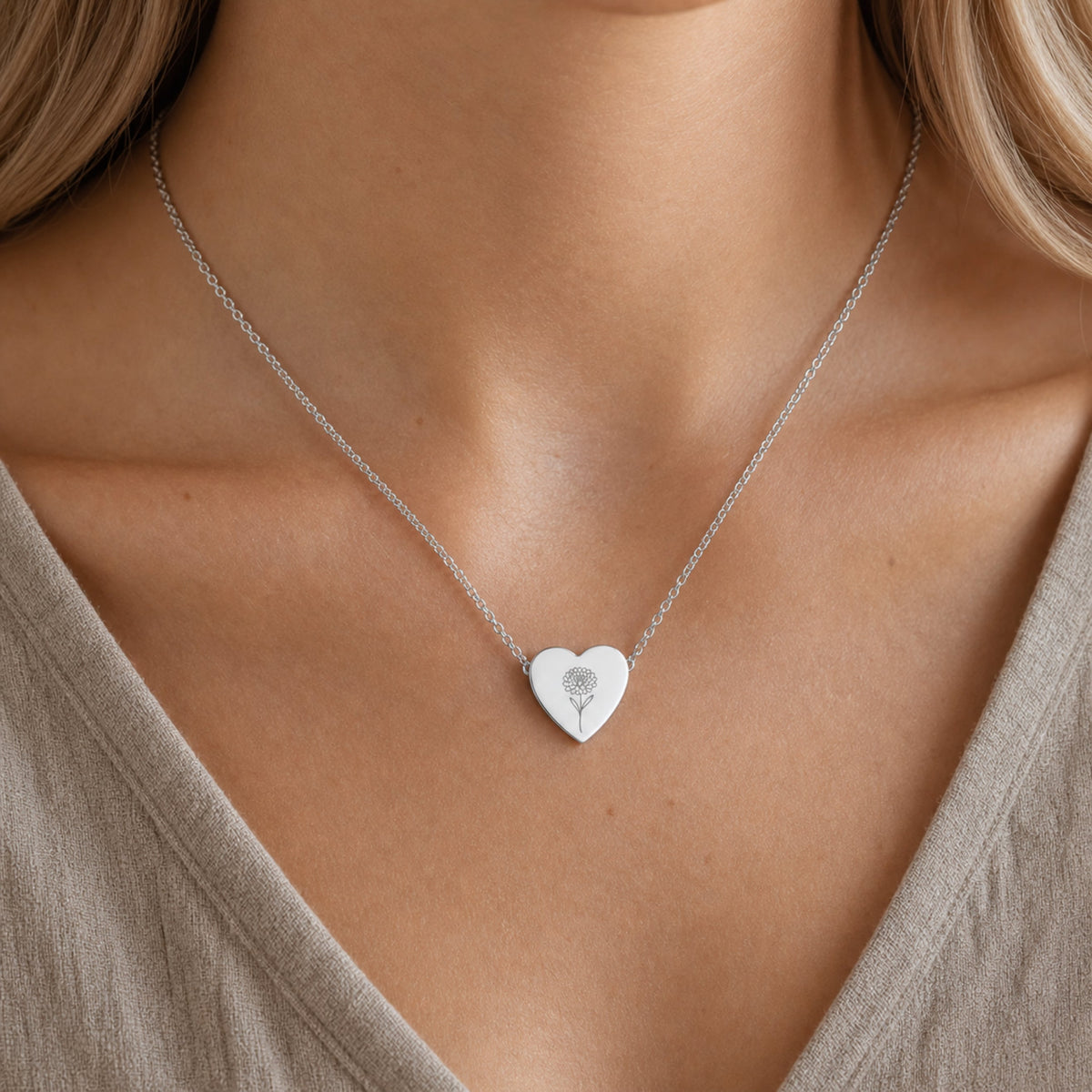 November birth flower necklace with chrysanthemum engraving in polished 316L stainless steel, worn on model