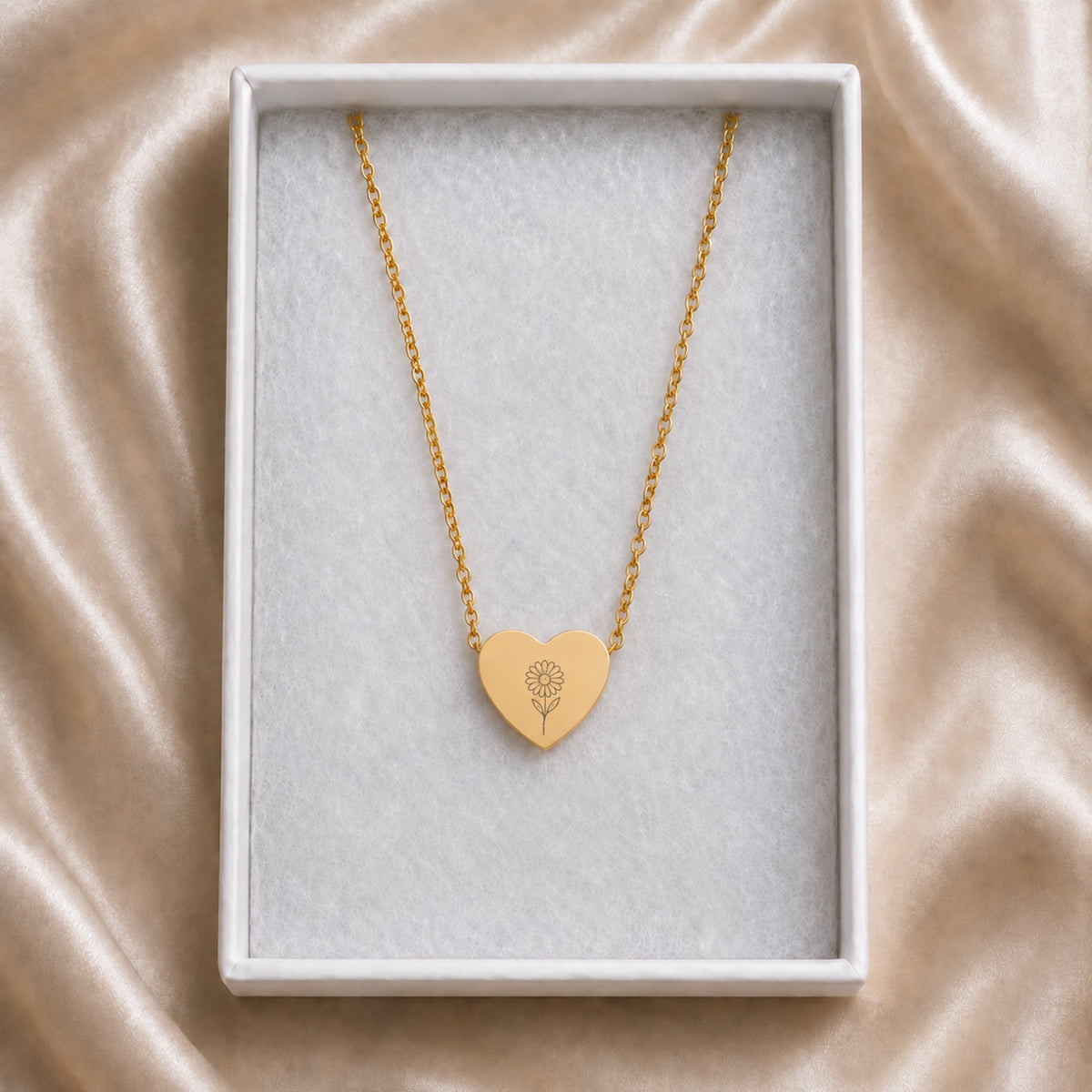 April birth flower necklace with daisy engraving in cream gift box, ready to give