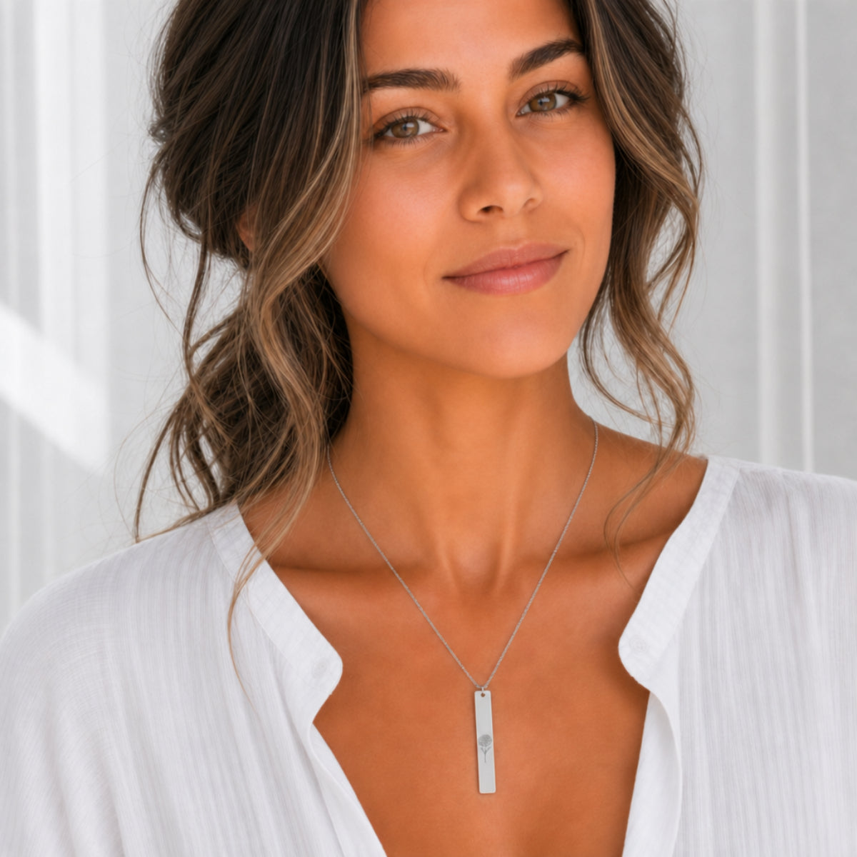 November birth flower necklace — Chrysanthemum engraved vertical bar pendant, Stainless Steel finish, model wearing pendant, on-neck lifestyle