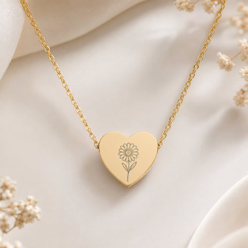 April birth flower necklace — daisy heart pendant hero with daisy blooms