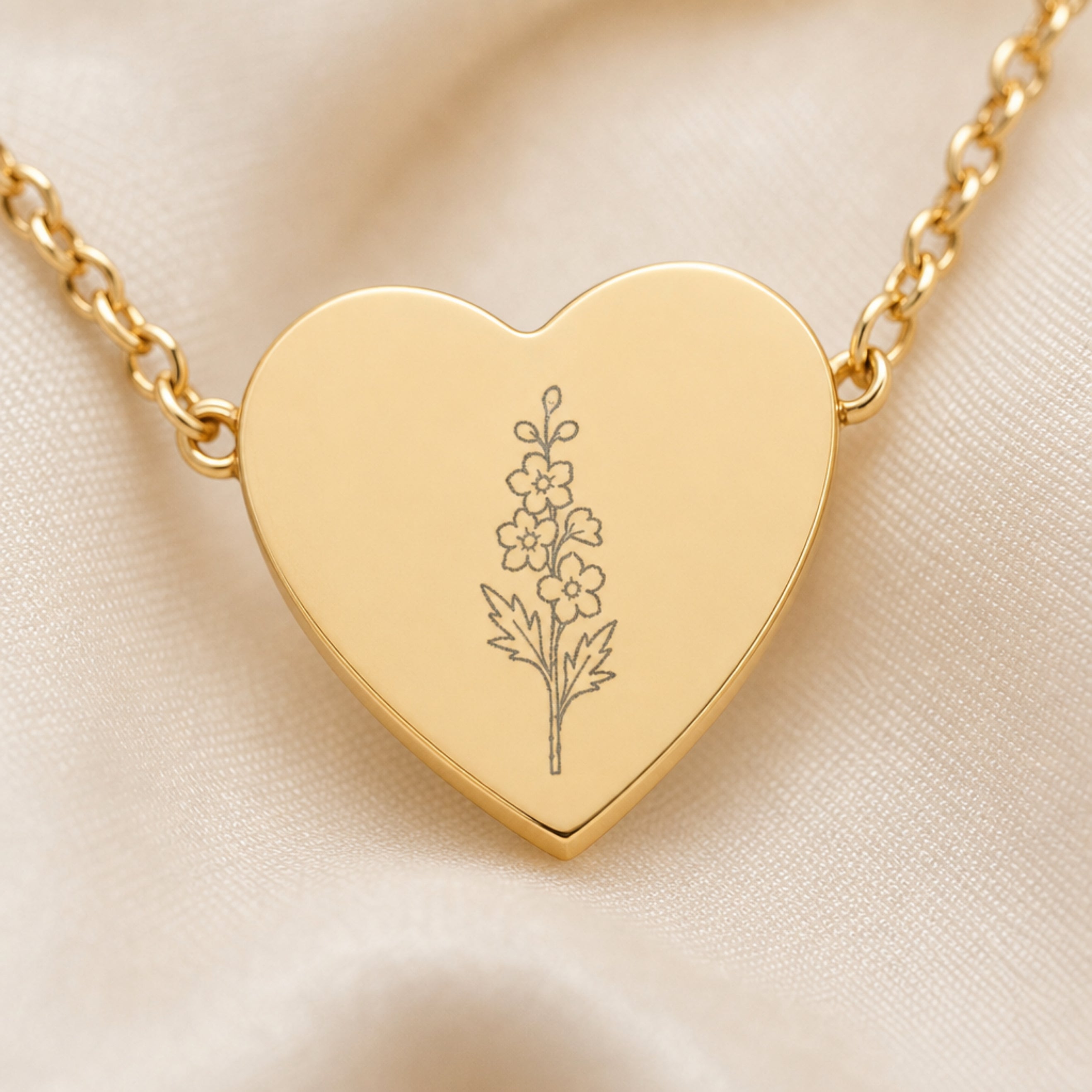 July larkspur engraving close-up — laser-etched detail on heart pendant in 18K Gold PVD