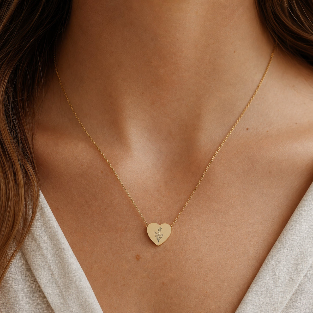 May birth flower necklace with lily of the valley engraving in 18K Gold PVD, worn on model