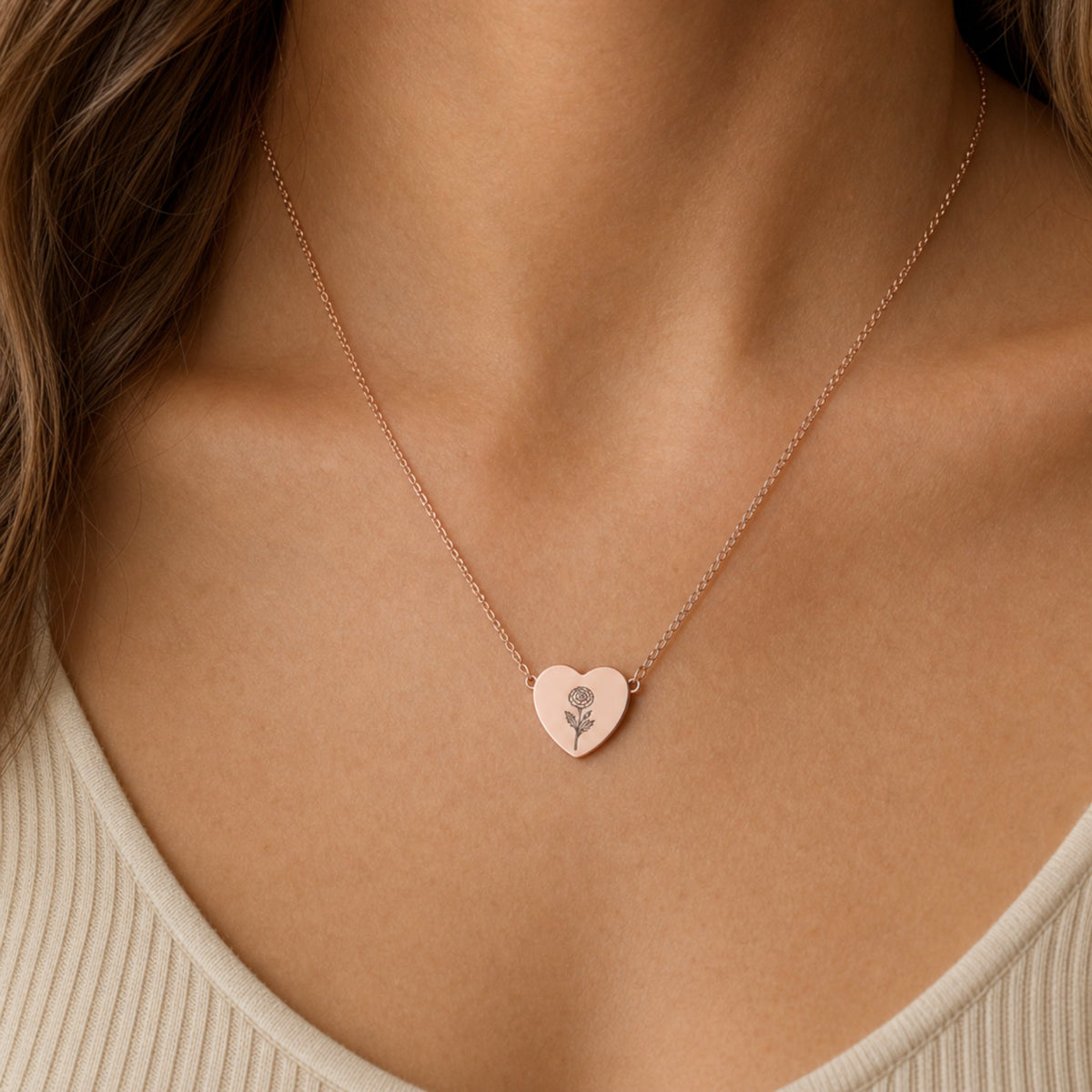 October birth flower necklace with marigold engraving in 18K Rose Gold PVD, worn on model