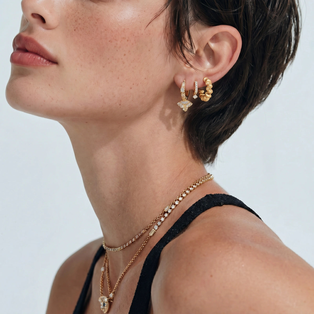 Twisted Gold Hoop Earrings with sculptural rope texture in a close product view