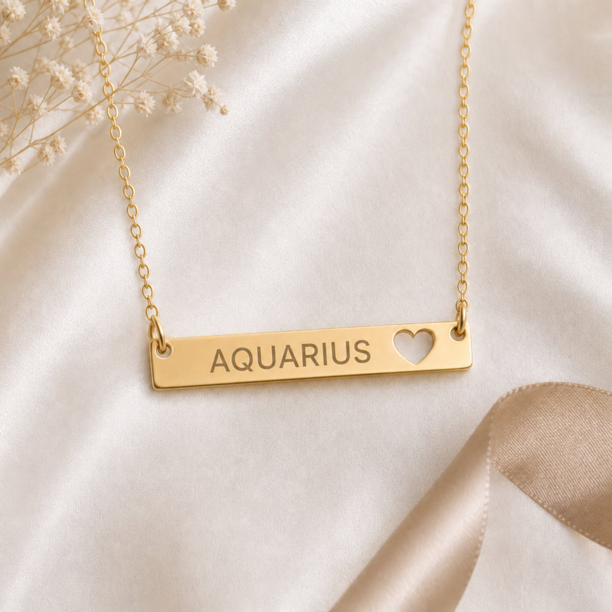 Aquarius zodiac necklace — cutout heart bar pendant flatlay with dried botanicals on cream linen, premium editorial styling