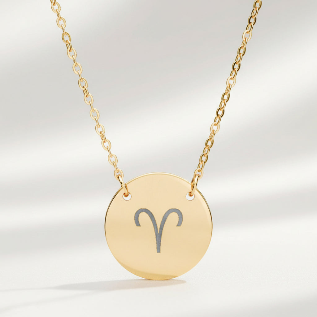 Aries zodiac coin necklace close-up — laser-engraved Aries star sign on 18K gold pendant