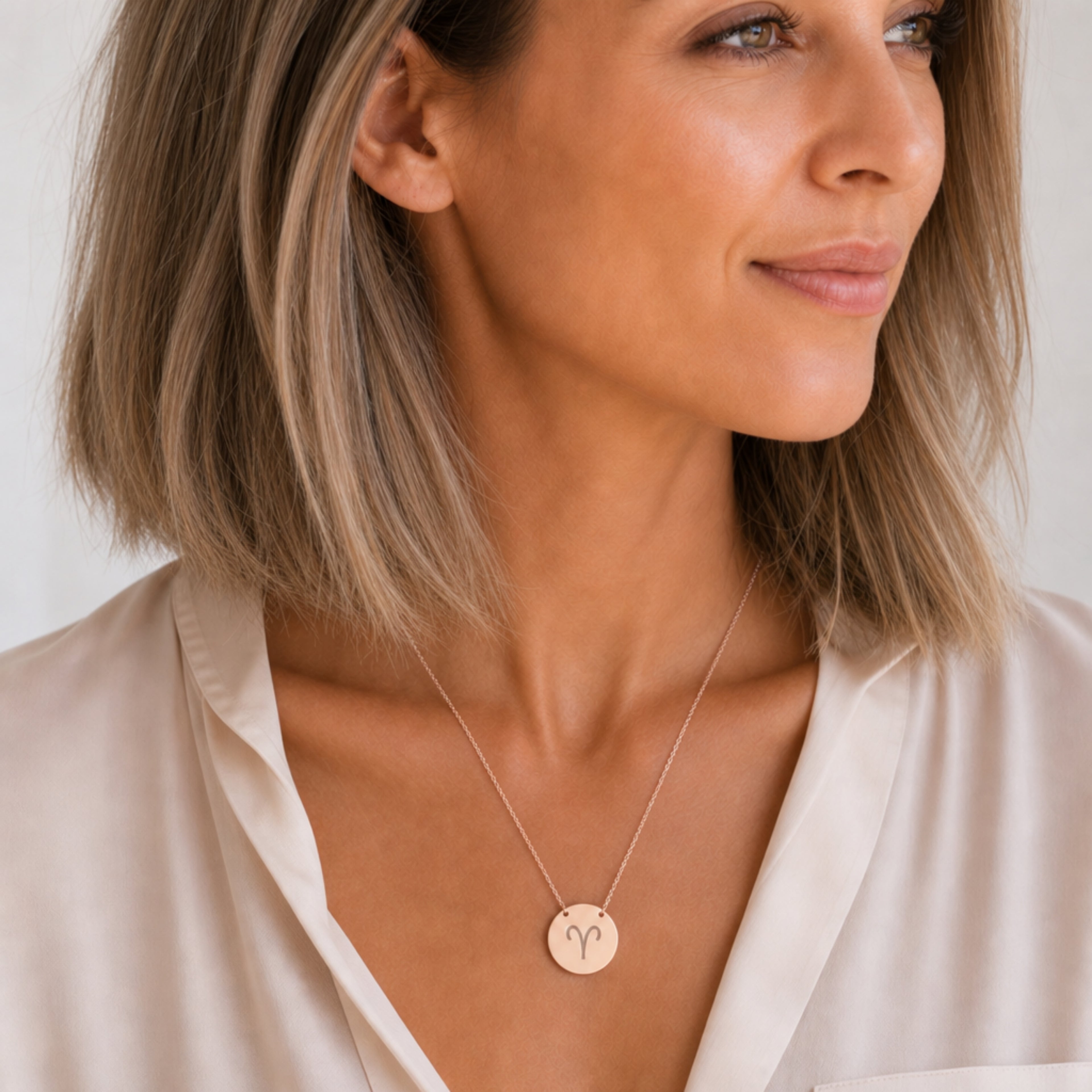 Aries zodiac coin necklace in 18K rose gold, laser-engraved Aries star sign pendant, worn on model