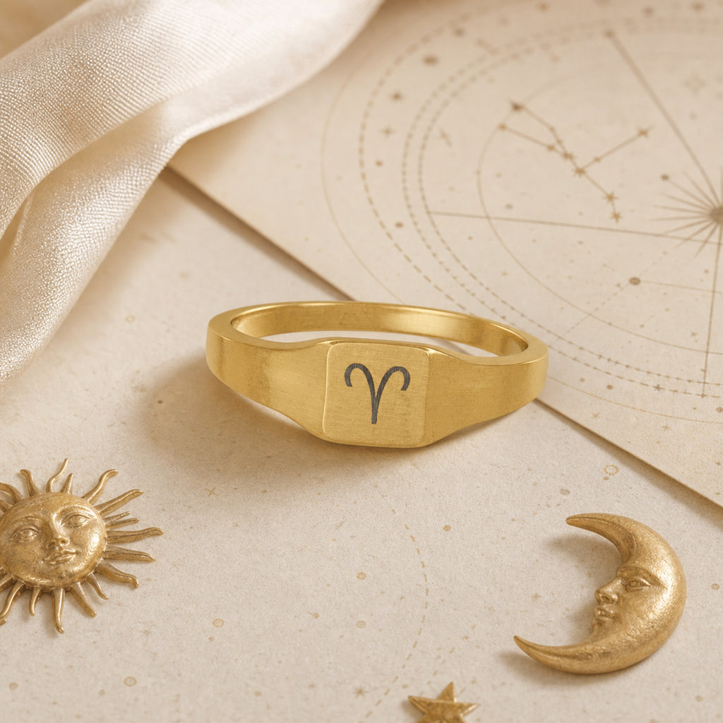 Aries zodiac square signet ring celestial flatlay — zodiac chart and brass star with engraved Aries signet, astrology gift styling