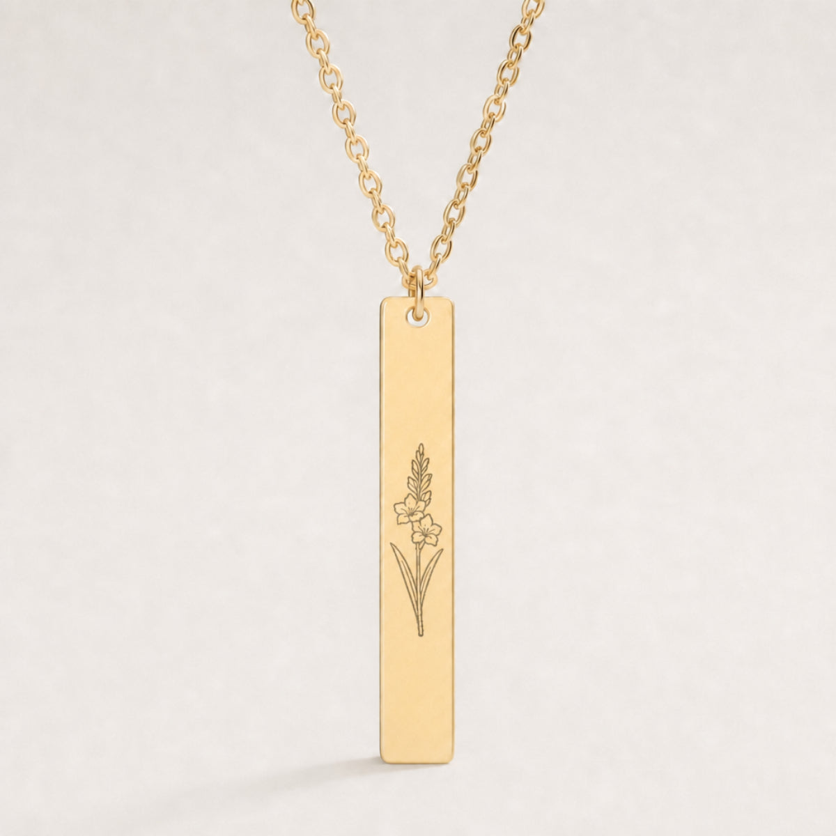 August birth flower necklace — Gladiolus engraved on 1.26" × 0.20" vertical bar pendant, premium close-up macro hero on 18K Gold PVD