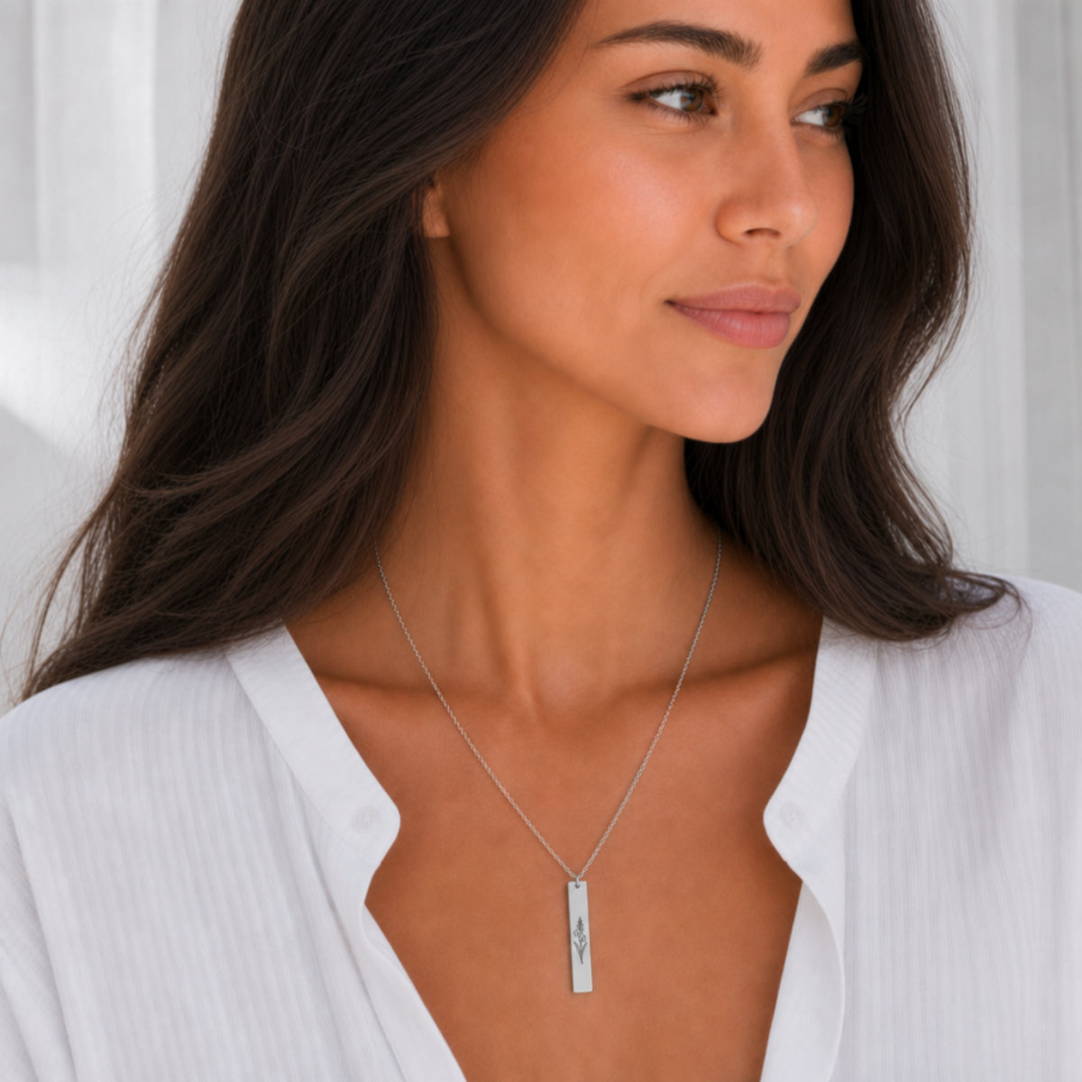 August birth flower necklace — Gladiolus engraved vertical bar pendant, Stainless Steel finish, model wearing pendant, on-neck lifestyle
