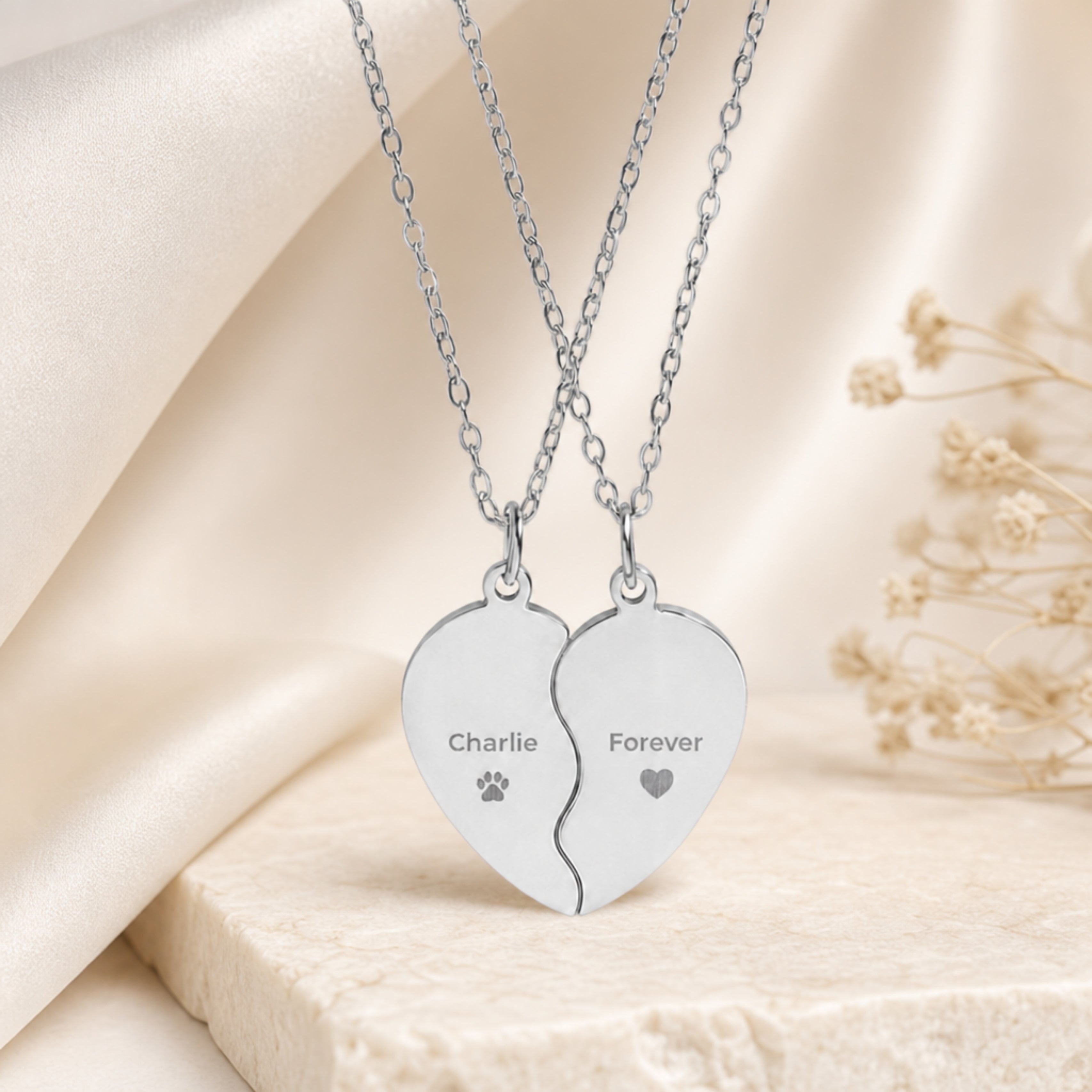 Memory That Lasts Break Apart pet memorial necklace, stainless steel finish, two-piece heart closeup with engraved name and paw print