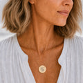 Cancer zodiac coin necklace worn on model in 18K gold — engraved Cancer Crab pendant resting on chest, layered everyday necklace, personalized birthday gift for Cancerian, June July zodiac