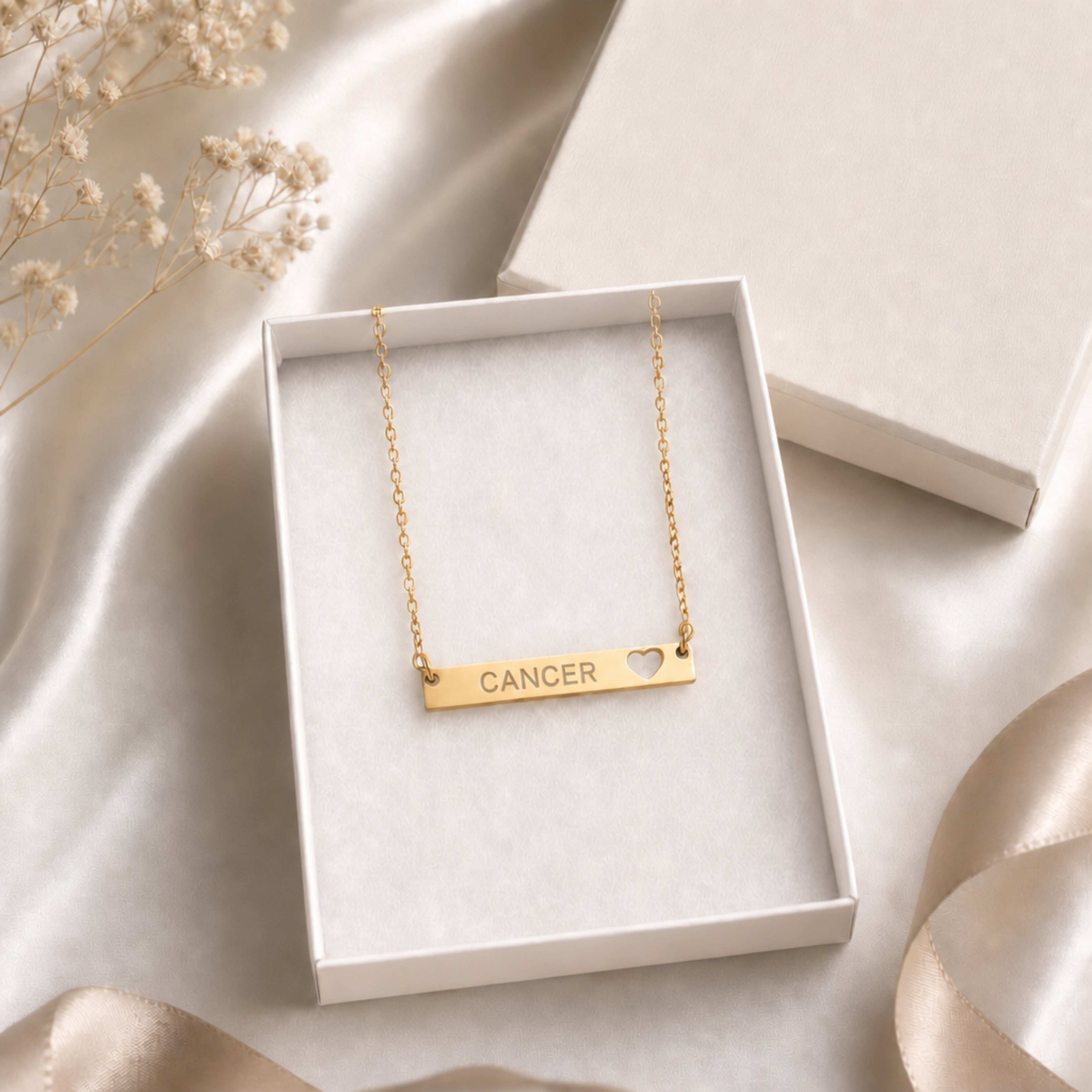 Cancer zodiac necklace — cutout heart bar pendant in cream gift-ready box, premium editorial unboxing