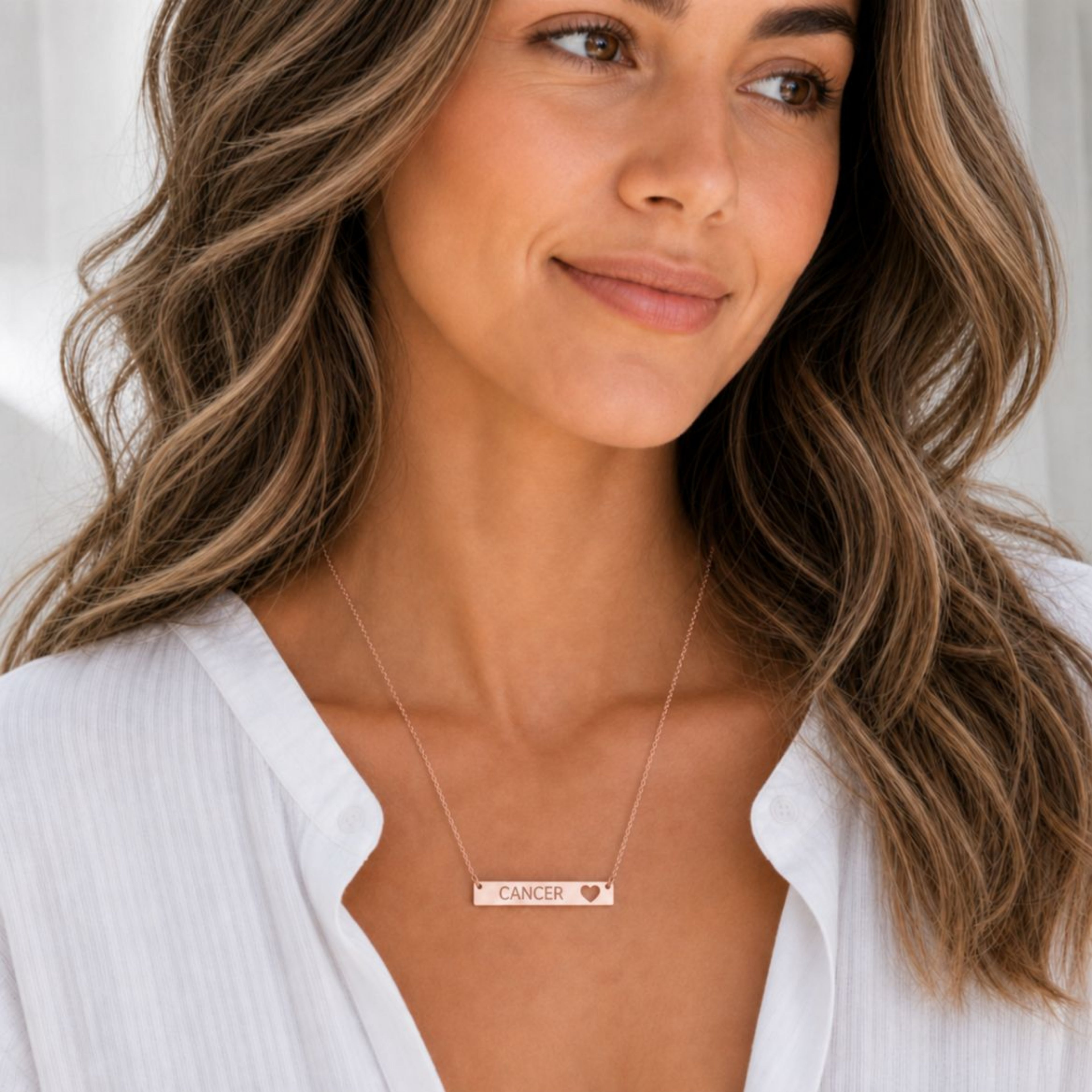 Cancer zodiac necklace — cutout heart bar pendant, 18K Rose Gold PVD finish, model wearing pendant, on-neck lifestyle