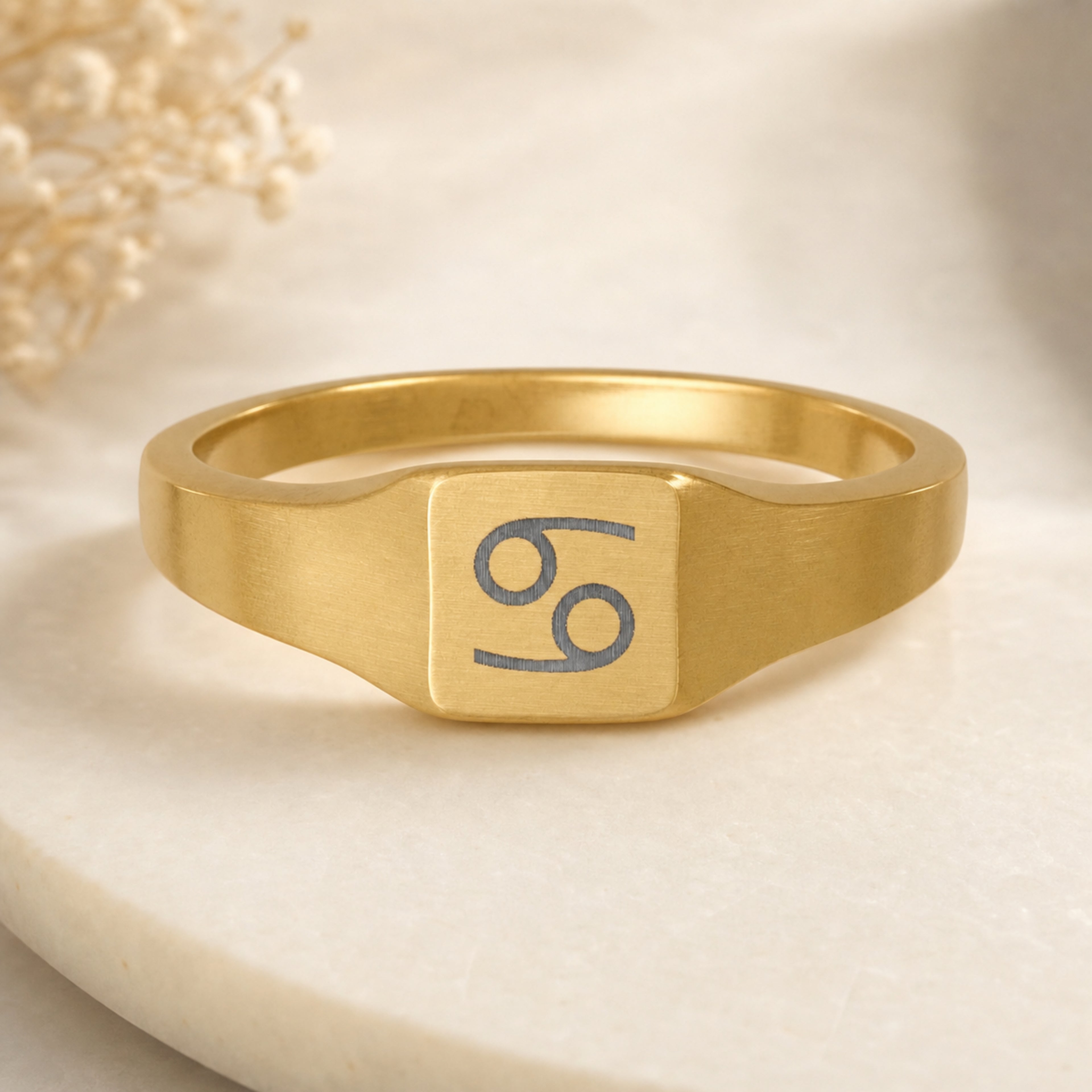 Cancer zodiac square signet ring — hero macro of laser-engraved Crab on 18K gold square face, premium personalized astrology ring gift