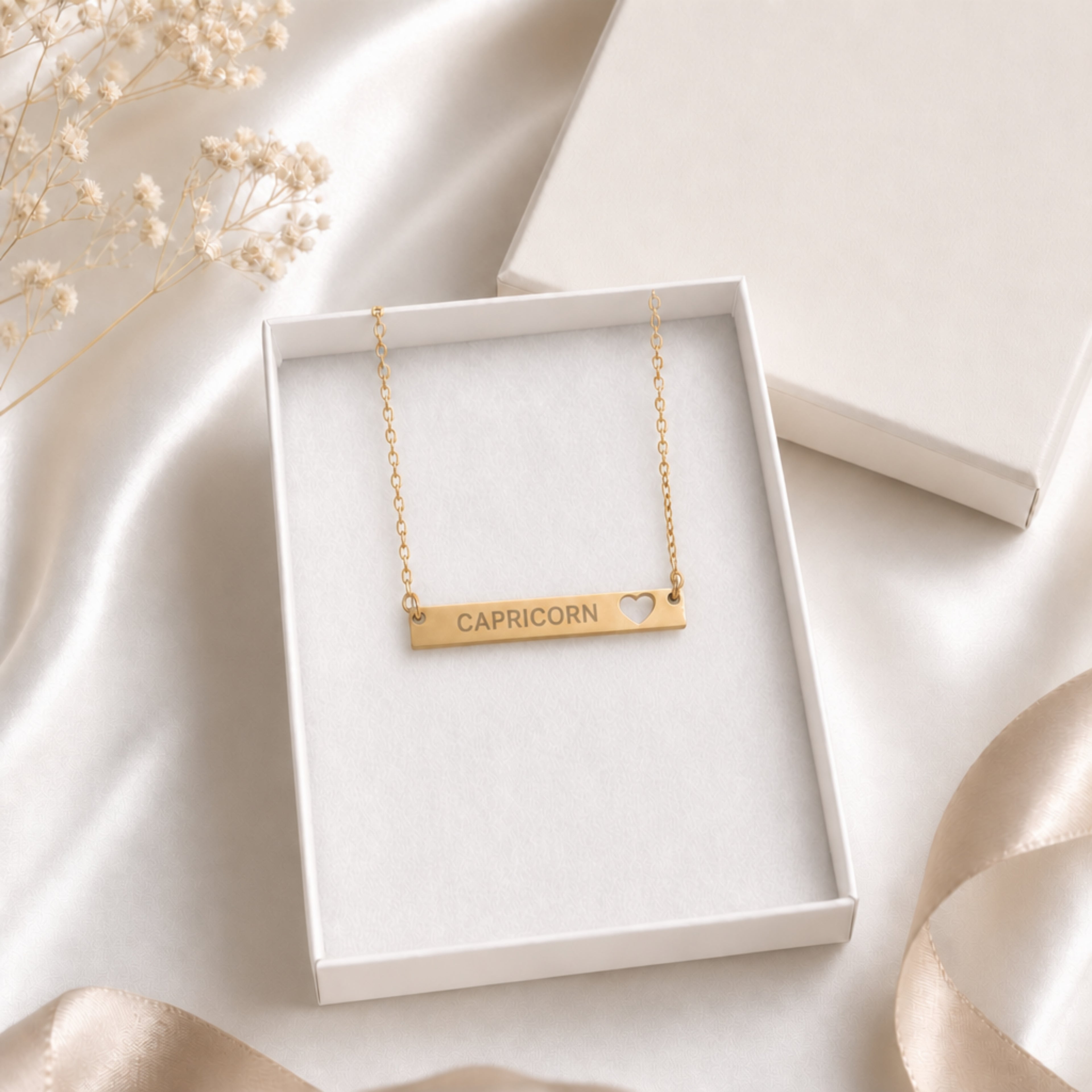 Capricorn zodiac necklace — cutout heart bar pendant in cream gift-ready box, premium editorial unboxing