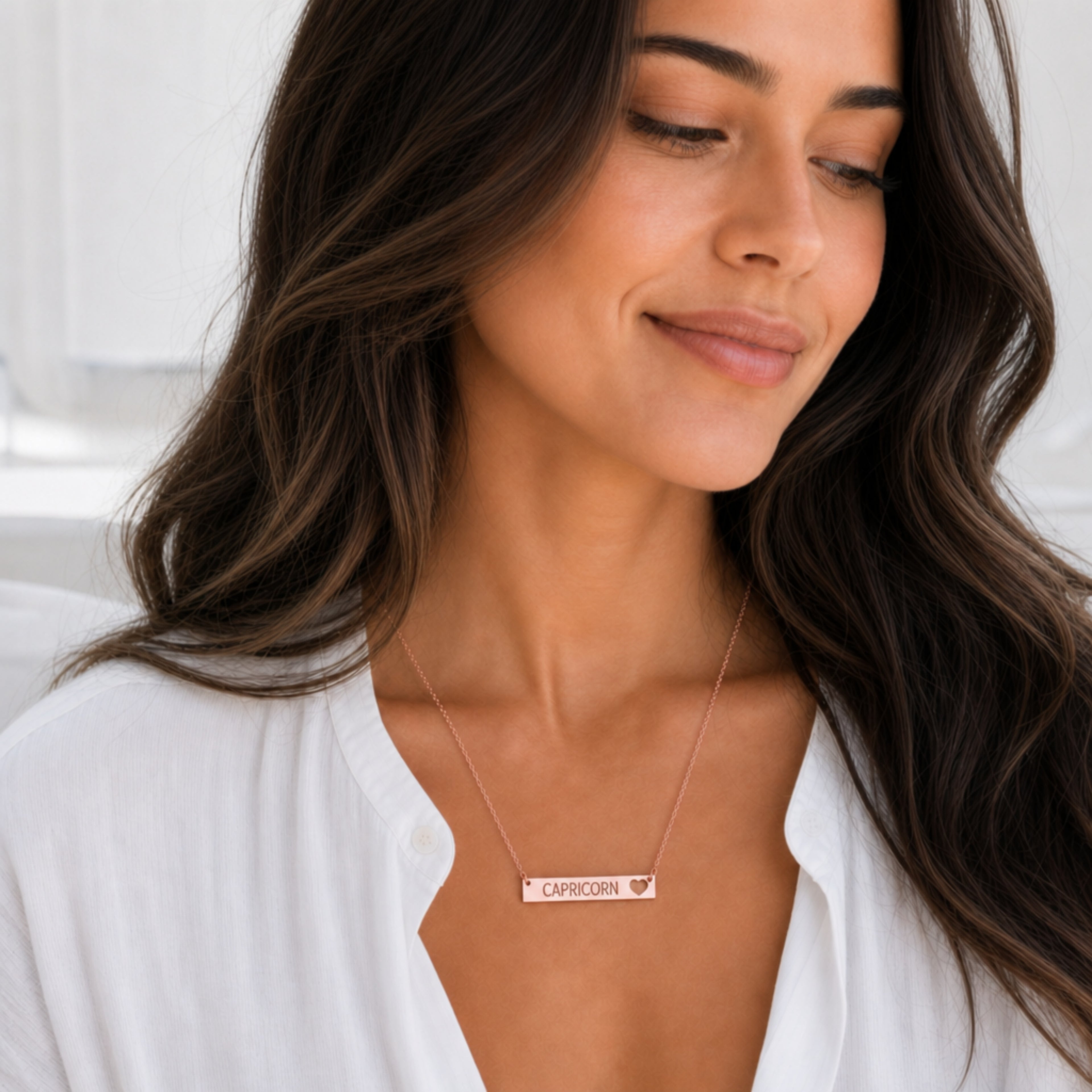 Capricorn zodiac necklace — cutout heart bar pendant, 18K Rose Gold PVD finish, model wearing pendant, on-neck lifestyle