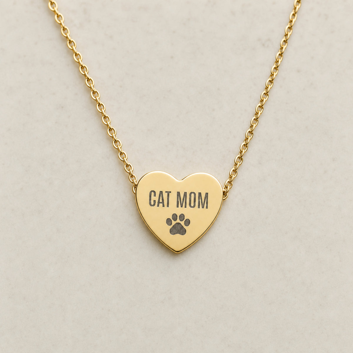 Memory That Lasts cat mom necklace, Gold finish, closeup held