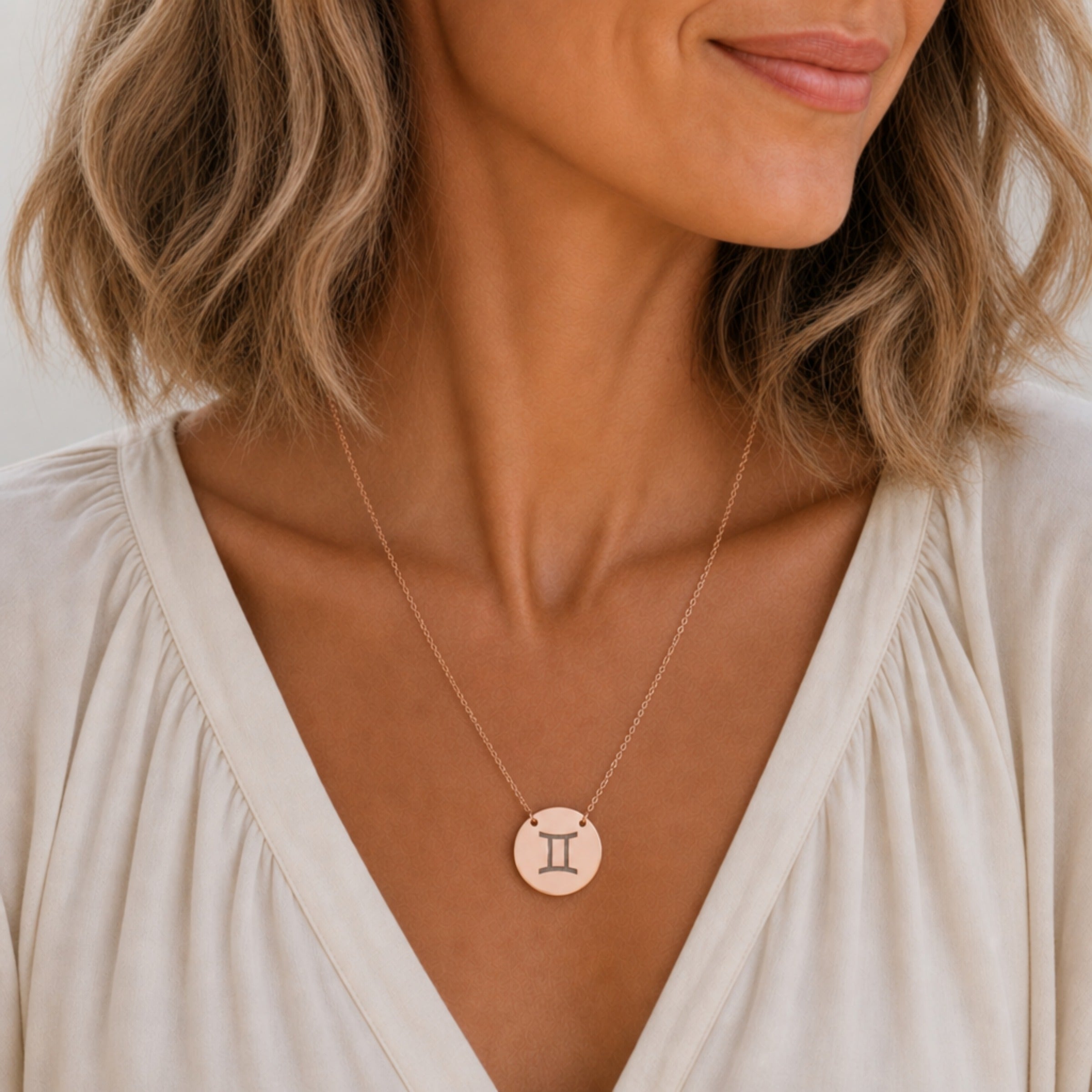 Gemini zodiac coin necklace in 18K rose gold worn on model — engraved Gemini Twins pendant, rose gold layering necklace, personalized birthday gift for Gemini