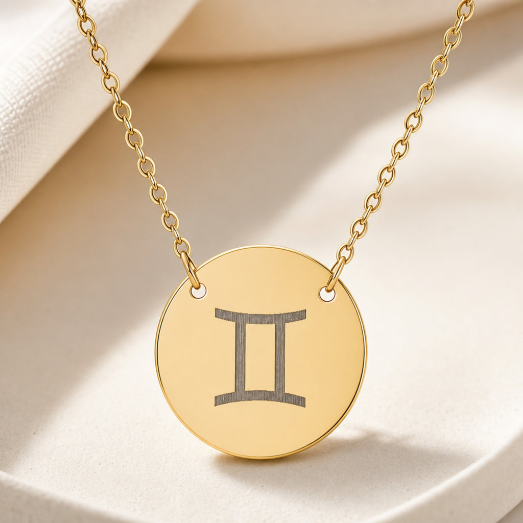 Gemini Coin Gold necklace close-up detail — macro of laser-engraved Gemini Twins glyph on polished 18K gold disc pendant, fine engraving detail, personalized zodiac astrology jewelry gift