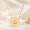 Memory That Lasts ladybug coin necklace, Gold finish, closeup macro