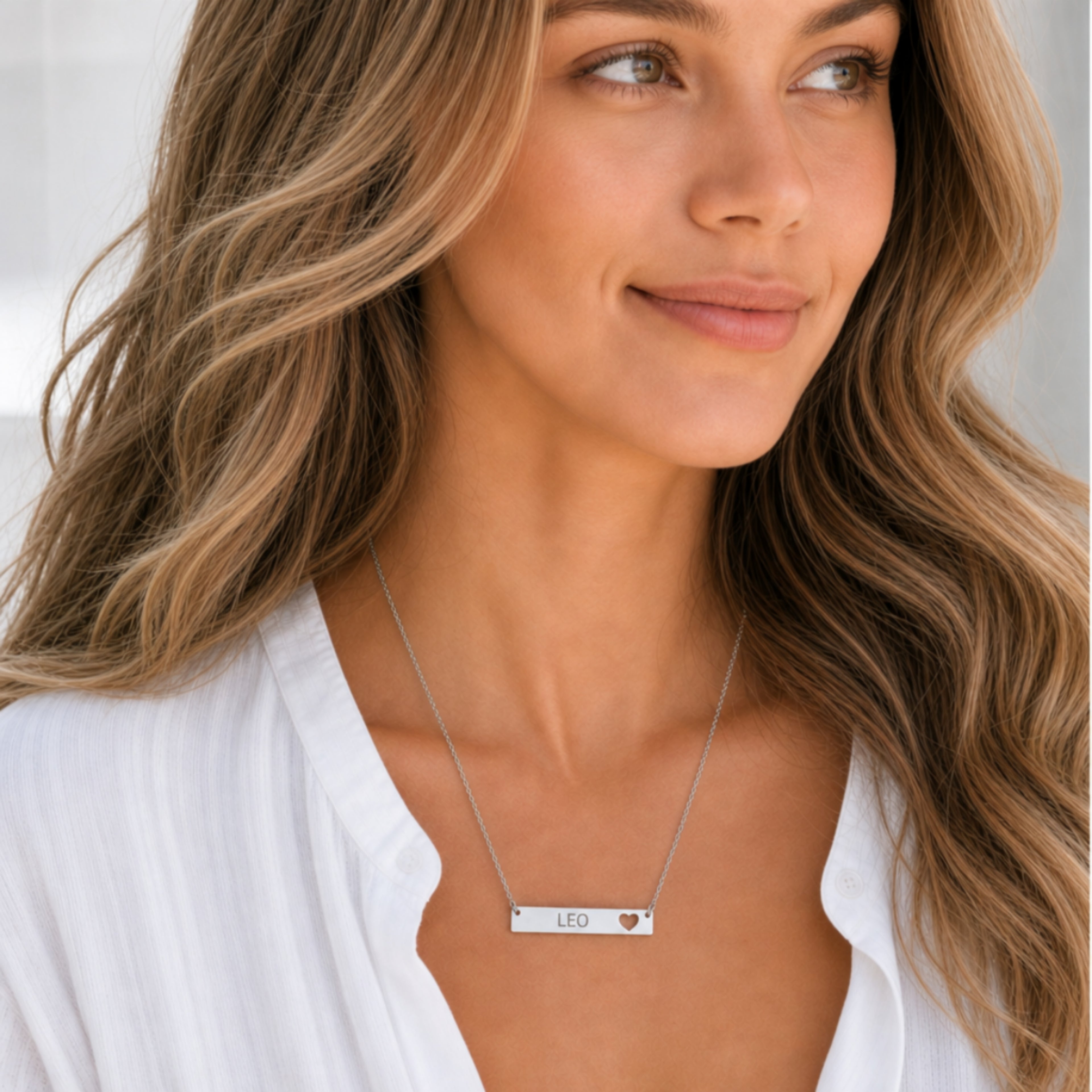 Leo zodiac necklace — cutout heart bar pendant, 316L stainless steel polished mirror finish, model wearing pendant, on-neck lifestyle