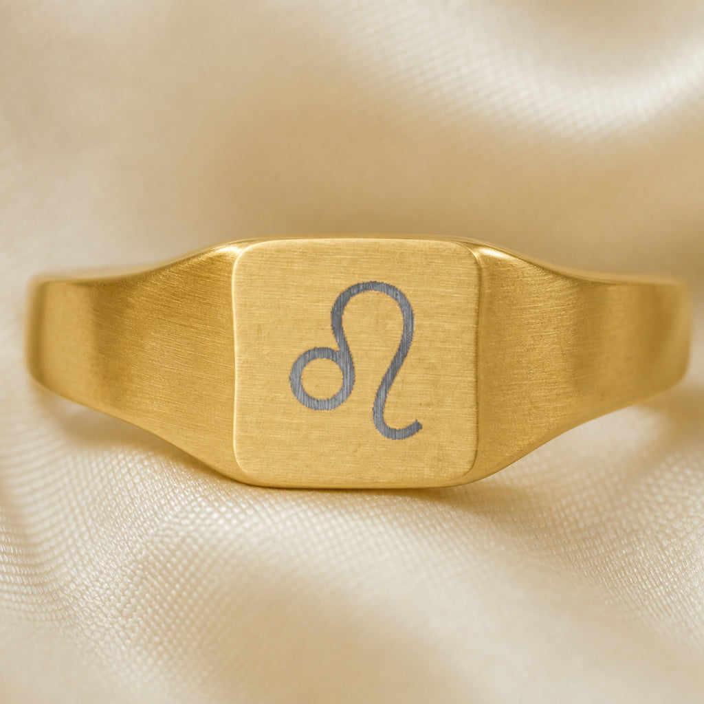 Leo zodiac square signet ring engraving close-up — laser-etched Lion detail, brushed grey on matte gold