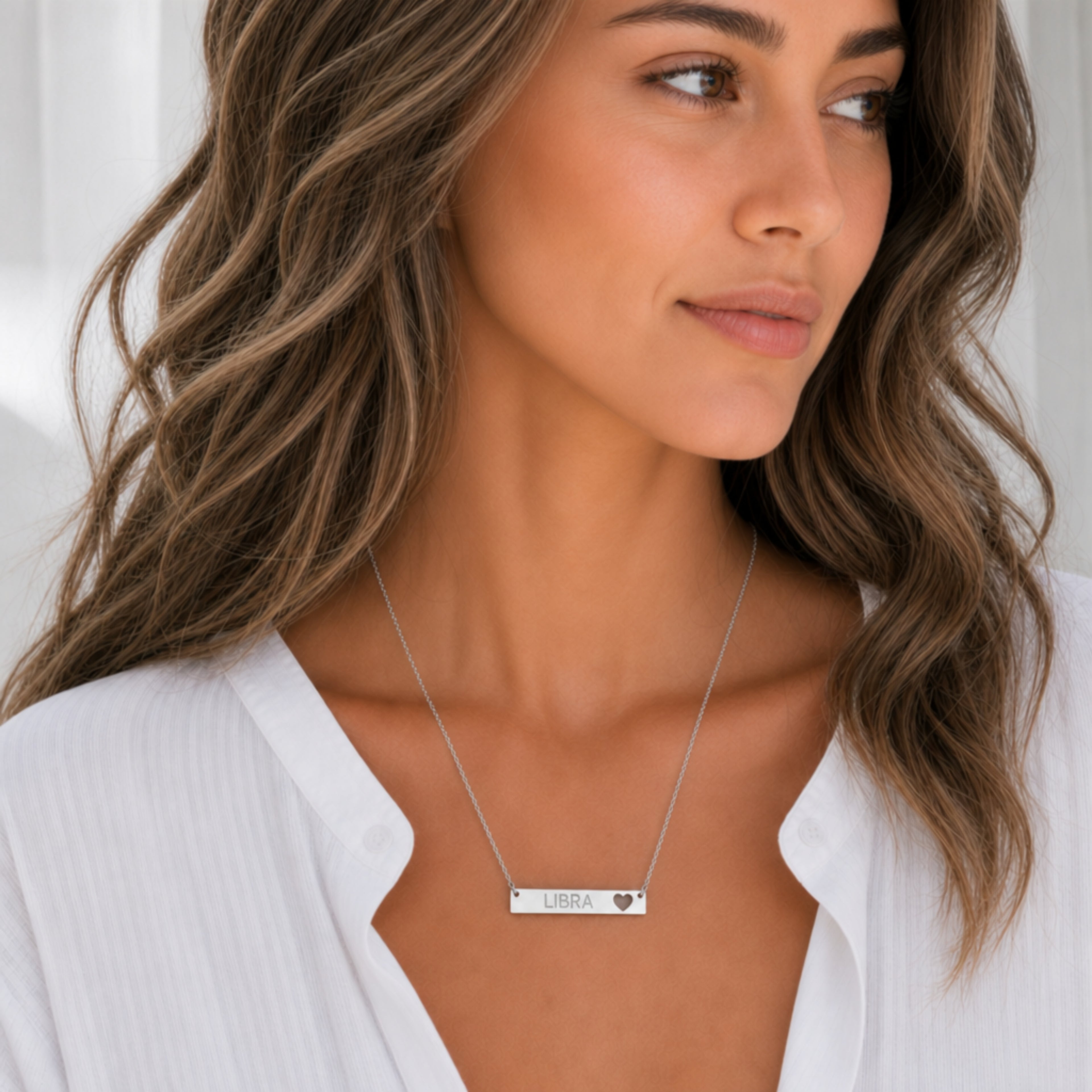 Libra zodiac necklace — cutout heart bar pendant, 316L stainless steel polished mirror finish, model wearing pendant, on-neck lifestyle
