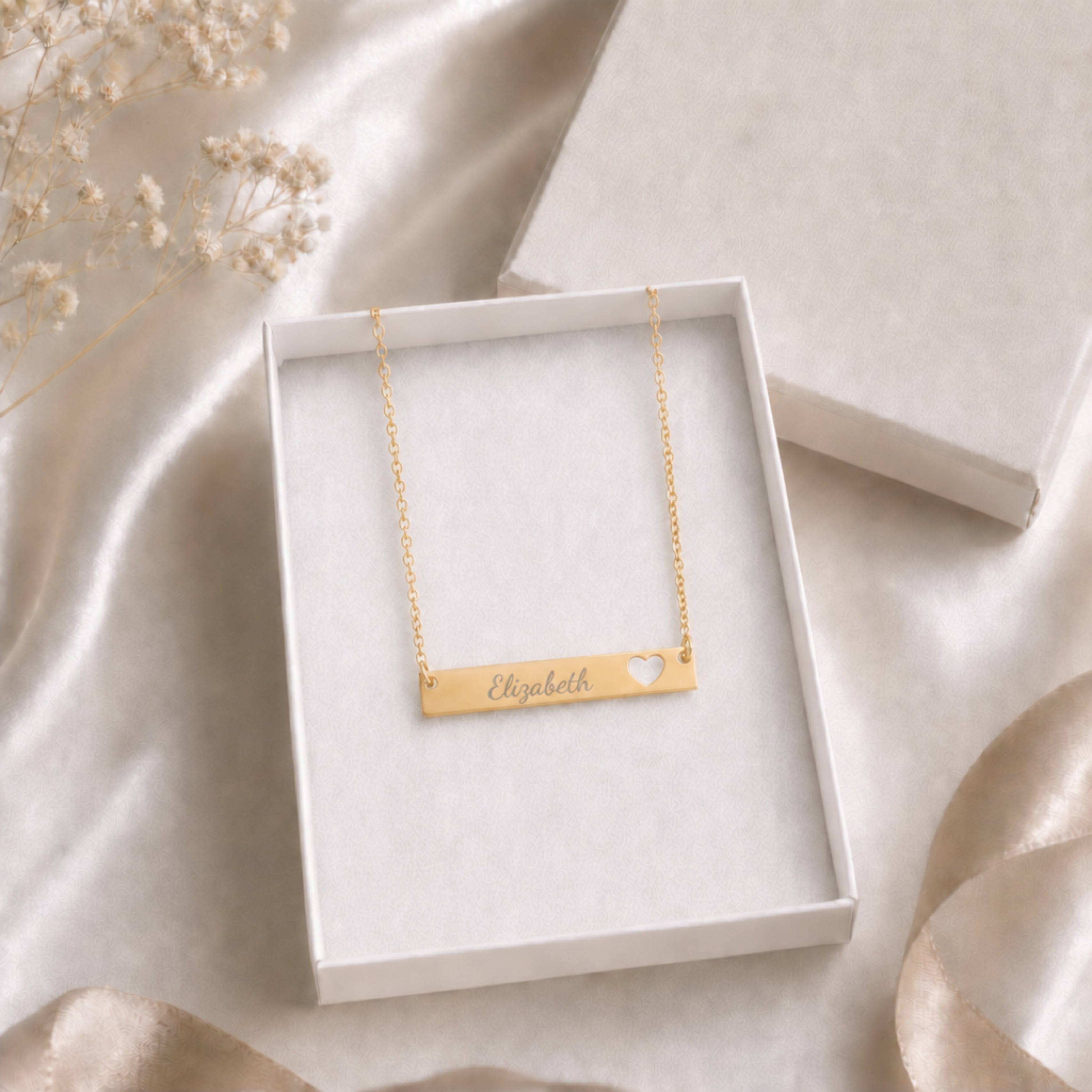Personalized heart-cutout name bar necklace in a gift box — ready-to-give engraved keepsake
