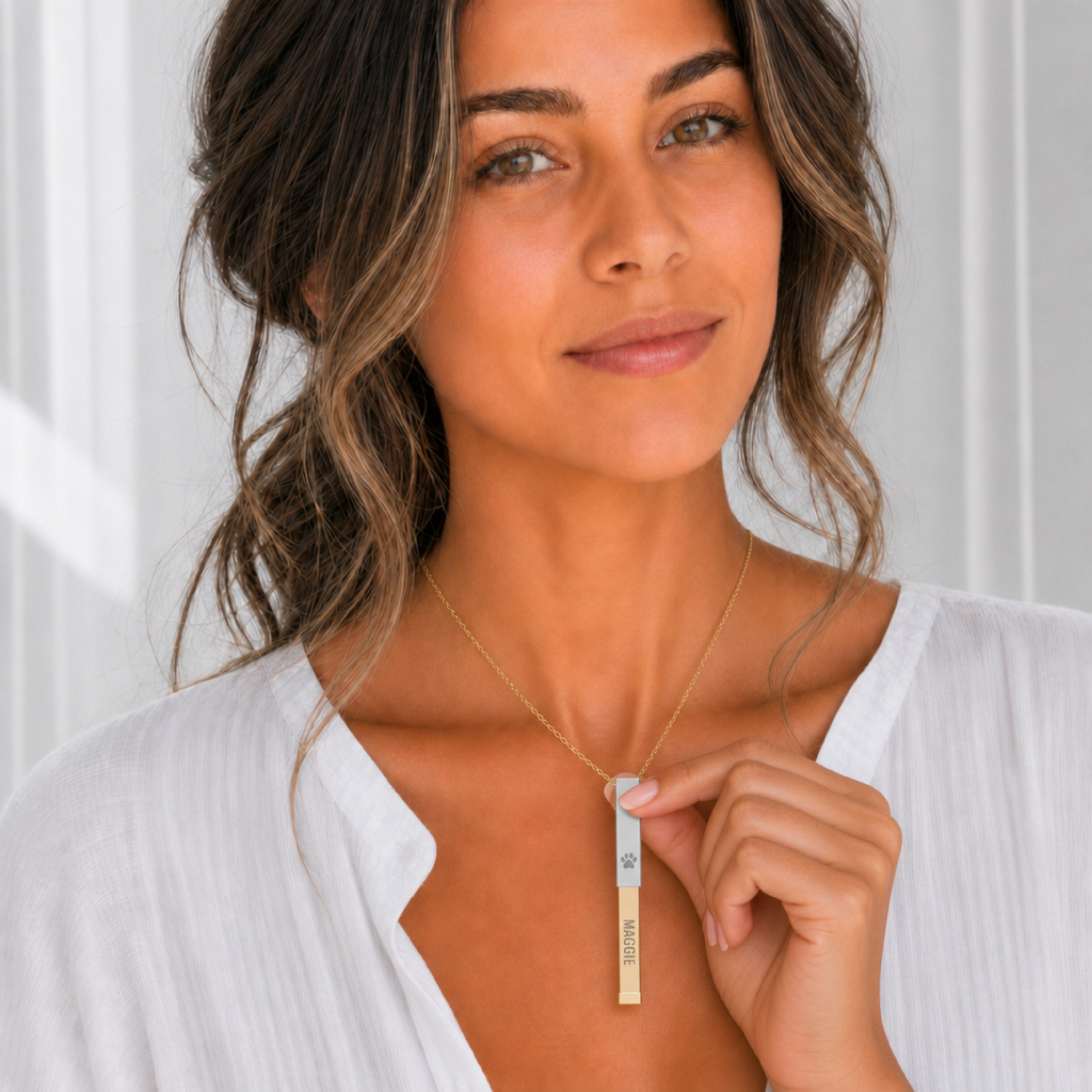 Hidden message sliding bar necklace slid open to reveal the engraved name, dog paw pendant