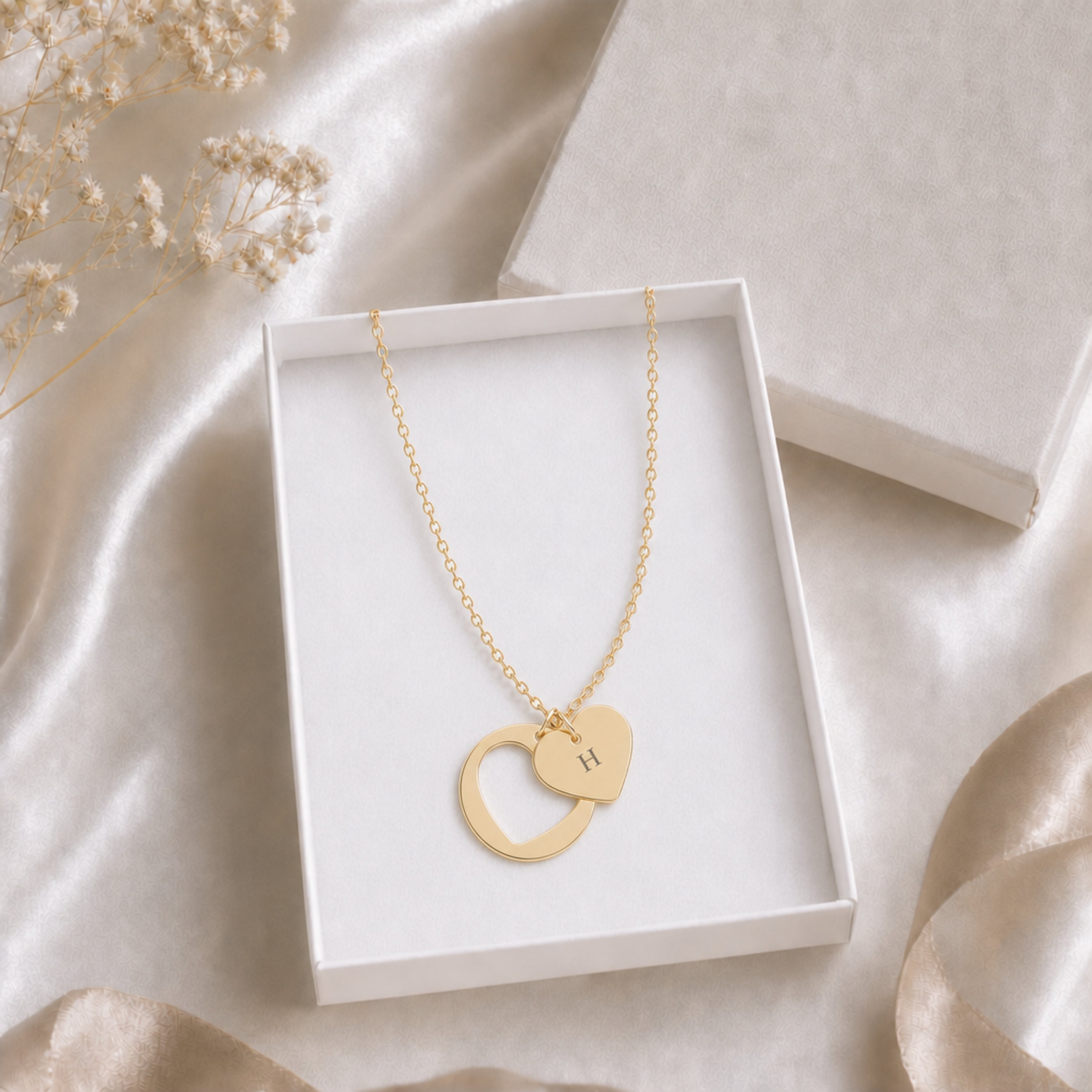 Personalized heart cutout initial necklace in a gift box, ready to give