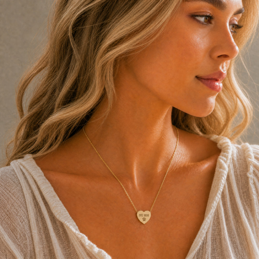 Dog Mom heart necklace in 18K gold — worn at collarbone