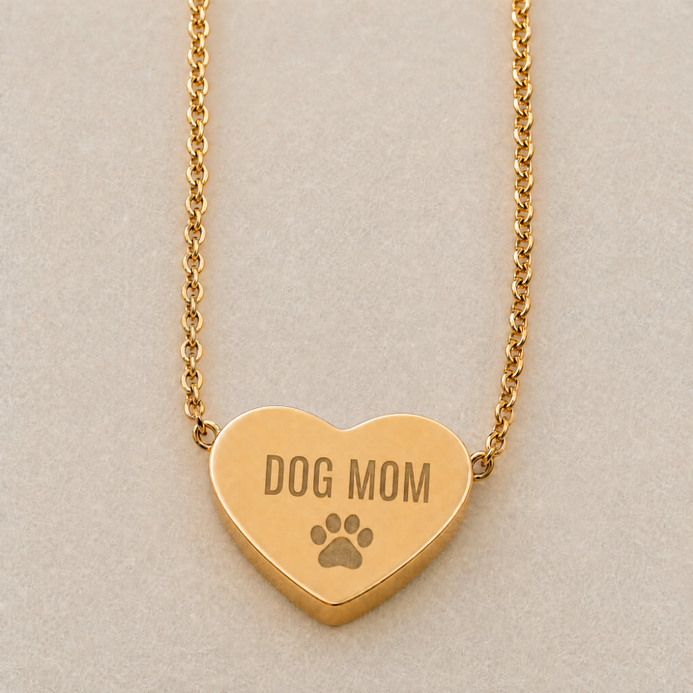 Dog Mom heart pendant engraving close-up — paw print laser detail