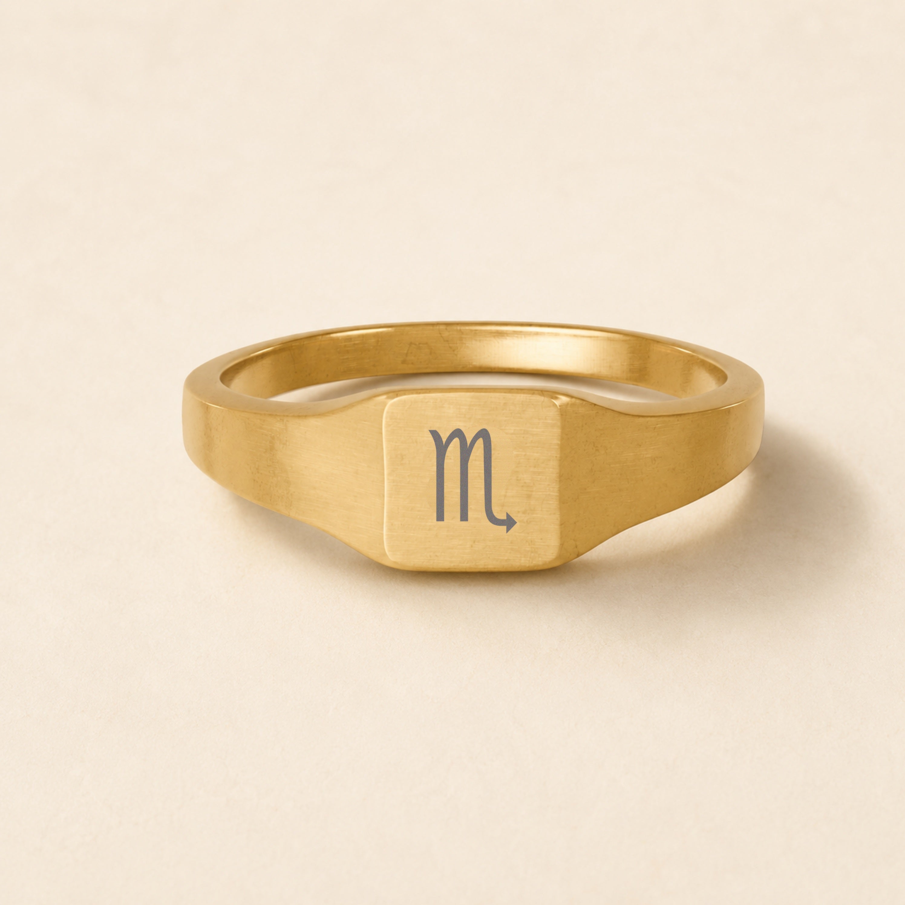 Scorpio zodiac signet ring — engraved Scorpio star sign on 18K gold square signet ring, studio macro hero