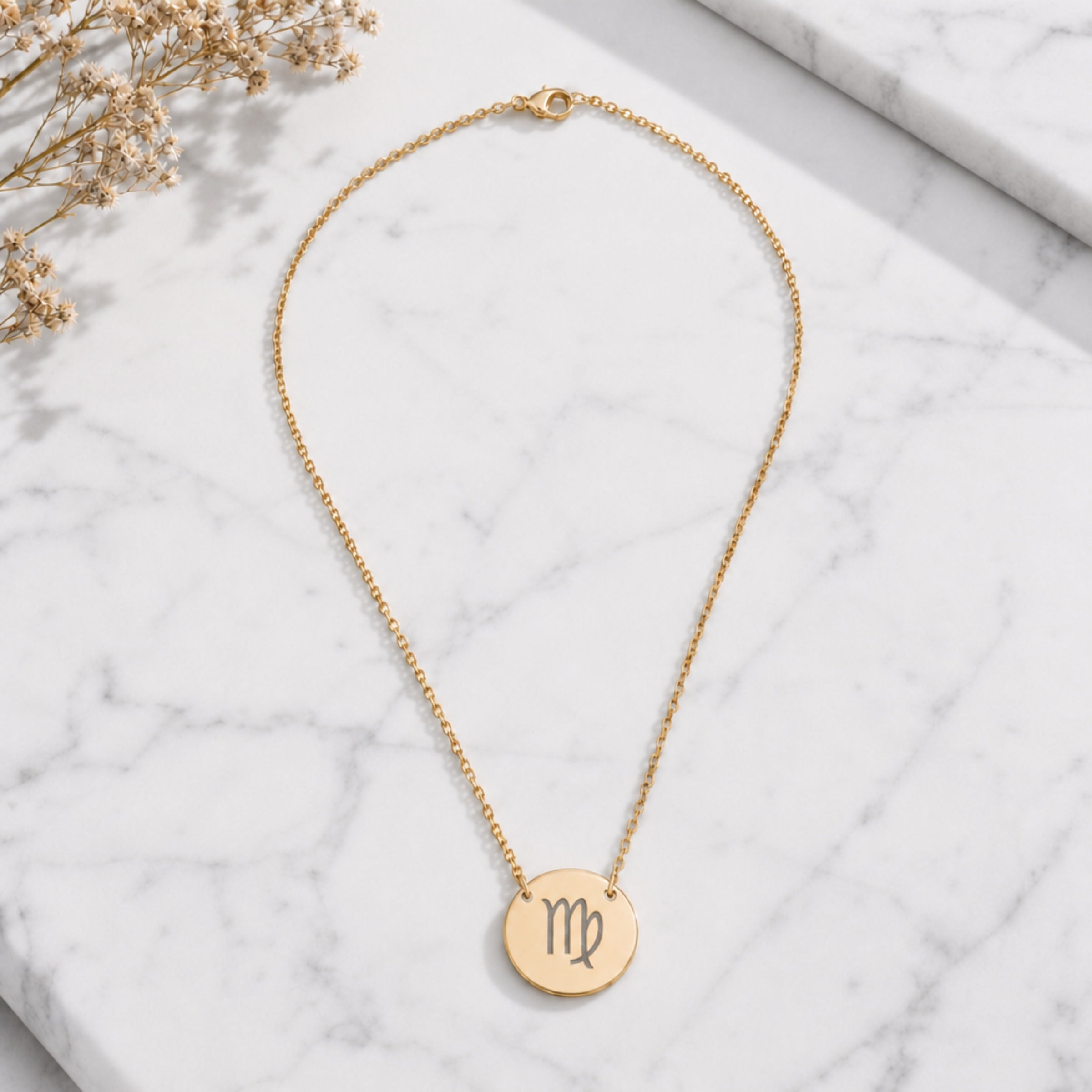 Virgo zodiac coin necklace marble flatlay — 18K gold pendant engraved with Virgo Maiden star sign on white marble with dried floral, premium personalized astrology necklace gift for September birthday, Virgoian present