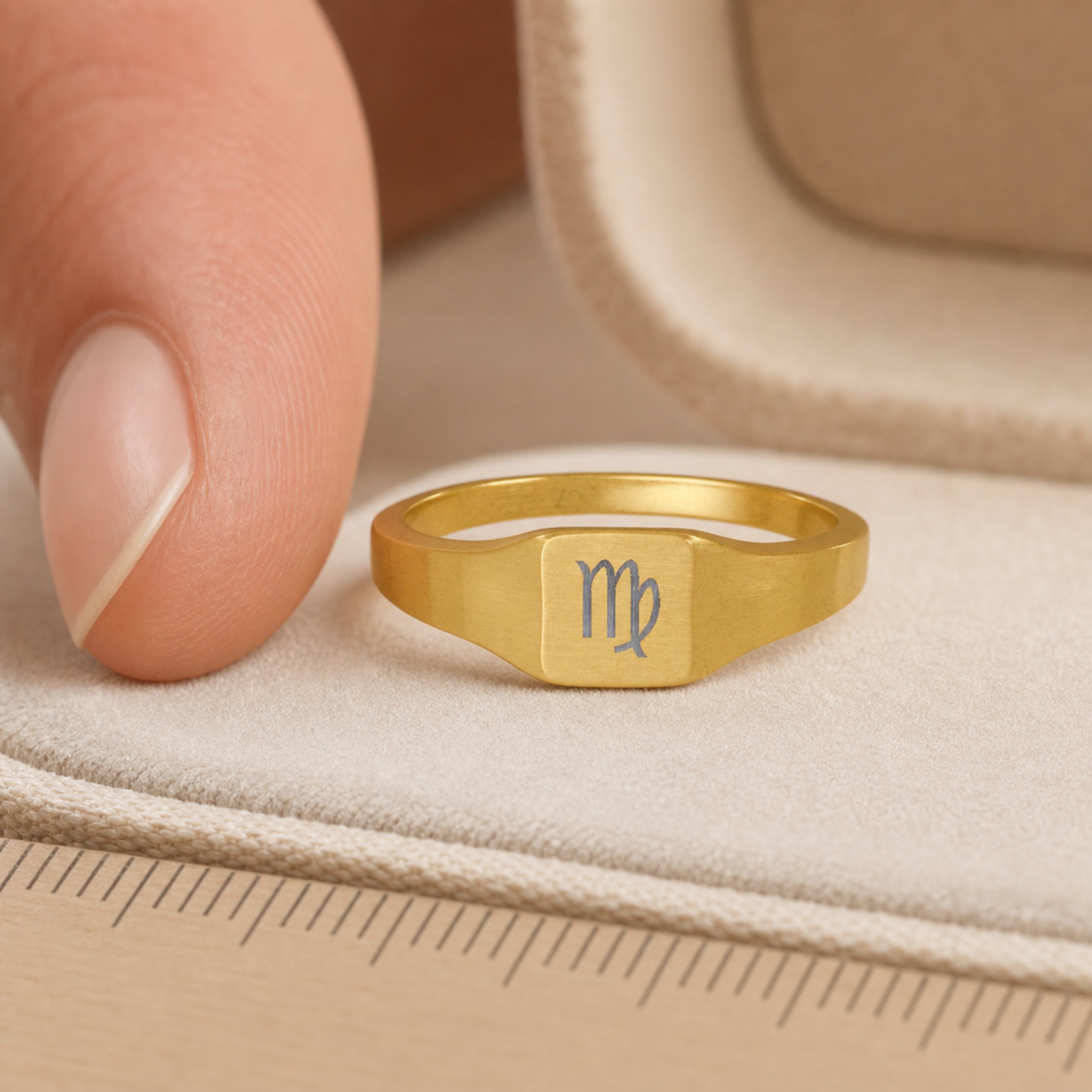 Virgo zodiac square signet ring scale-in-hand — fingers holding ring next to gift box and ruler, dainty 20mm signet sizing