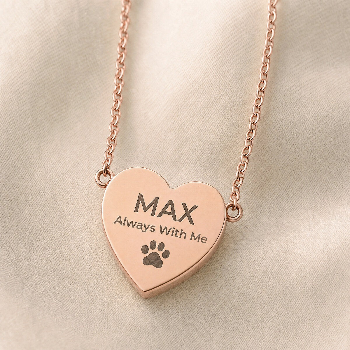 Always With Me heart pendant in 18K rose gold — close-up on cream linen
