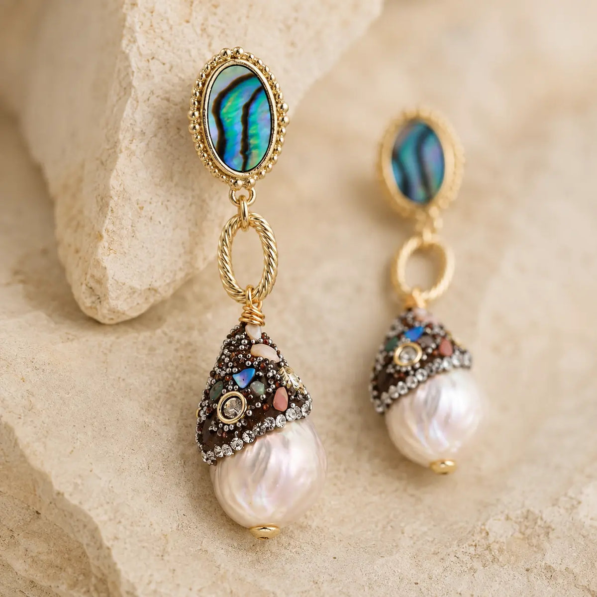 Close-up of Baroque Pearl Statement Earrings with abalone studs, jeweled caps and irregular white pearls