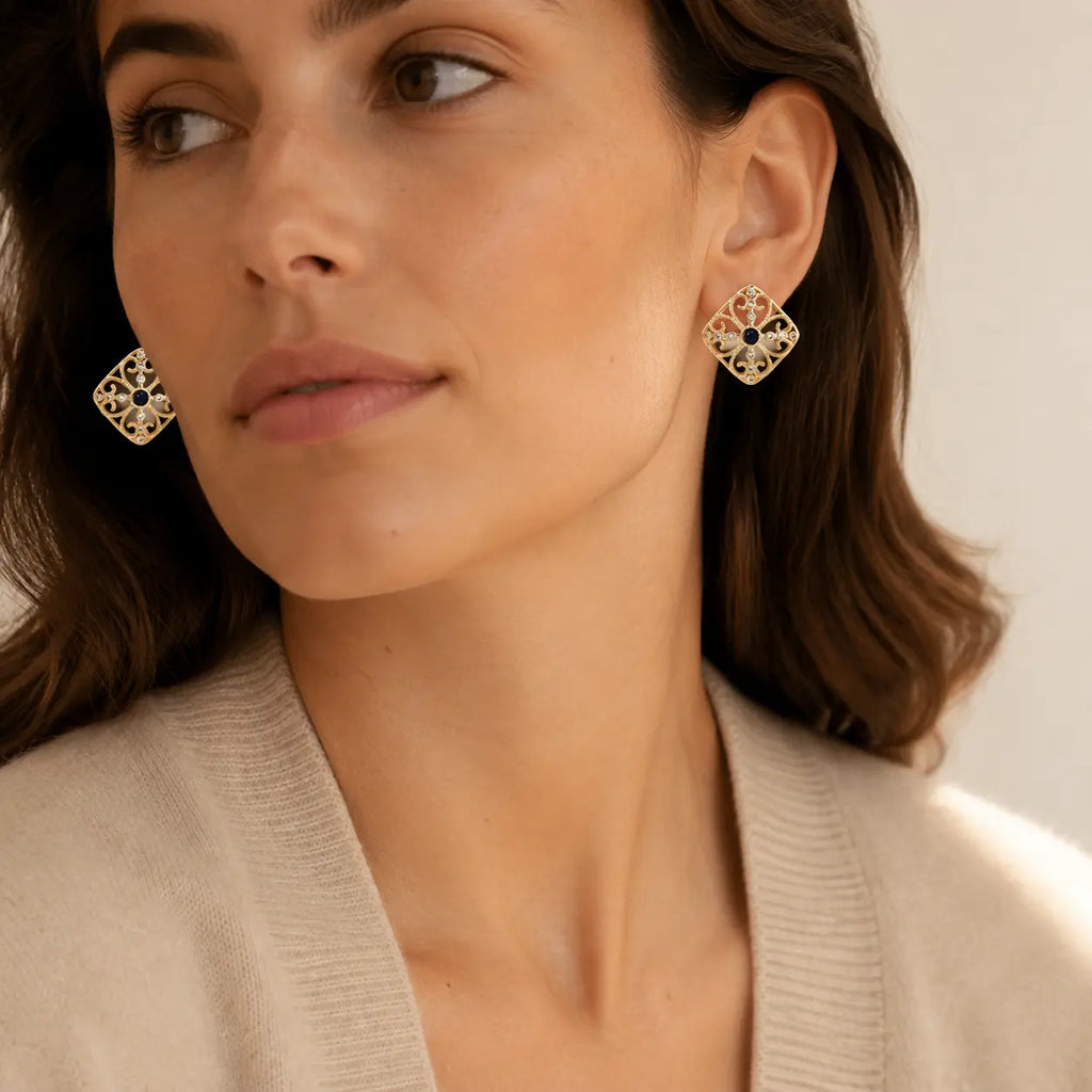 Woman wearing Byzantine Dream Studs with gold filigree and navy lapis centers