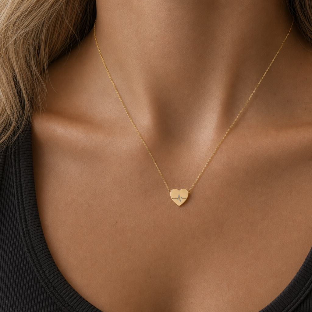Gold heartbeat heart necklace resting in a cream gift box, gift-ready - keep it or give it. Memory That Lasts.