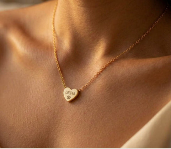 Gold heart necklace engraved with pet name and paw print