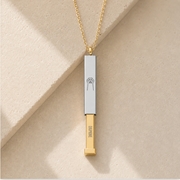 Gold and stainless hidden-message slider bar necklaces shown together, both engraved with a paw. Memory That Lasts.