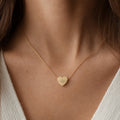 Heartbeat necklace lifestyle in 18K Gold PVD finish, worn on neck — EKG heart pendant for a new mom, anniversary, or keepsake gift (AI-generated image). Memory That Lasts.