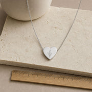 Gold May lily of the valley heart necklace nested in a cream gift box with fresh blooms, gift-ready - keep it or give it. Memory That Lasts.